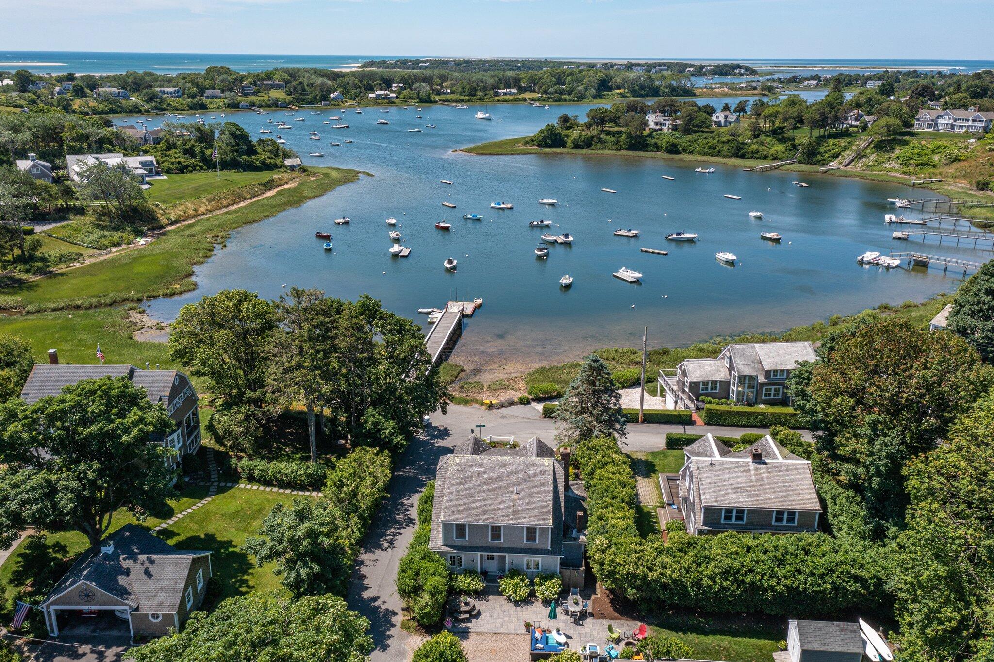 81 Mill Pond Road Chatham, MA 02633 - Photo 2 of 59 an aerial view of a house with a lake view