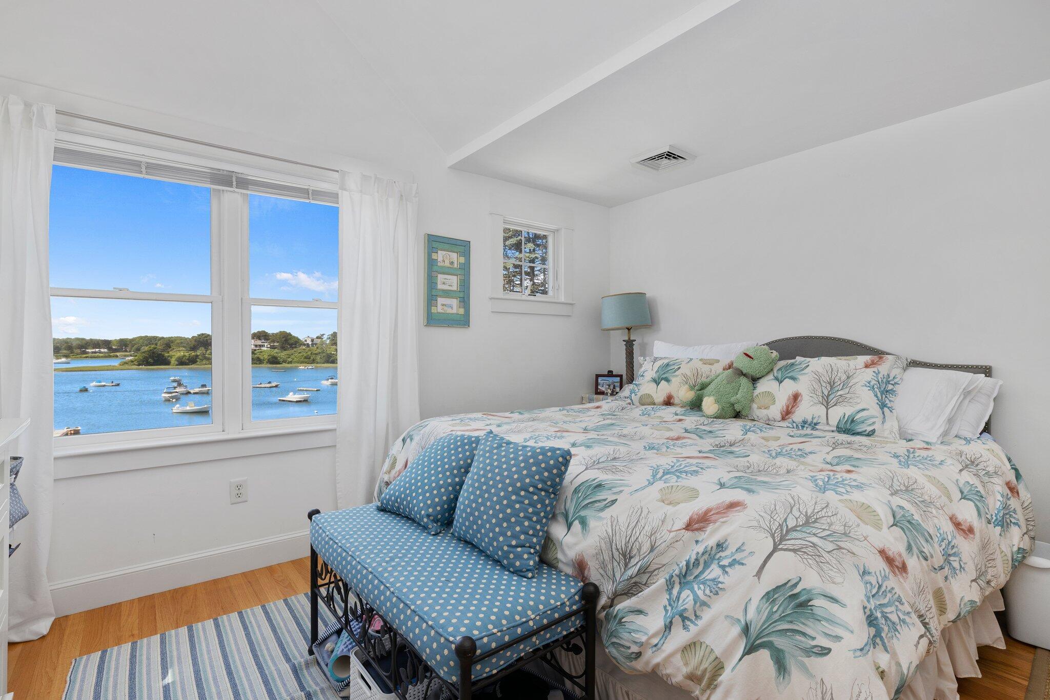 81 Mill Pond Road Chatham, MA 02633 - Photo 22 of 59 a bedroom with a bed and a window