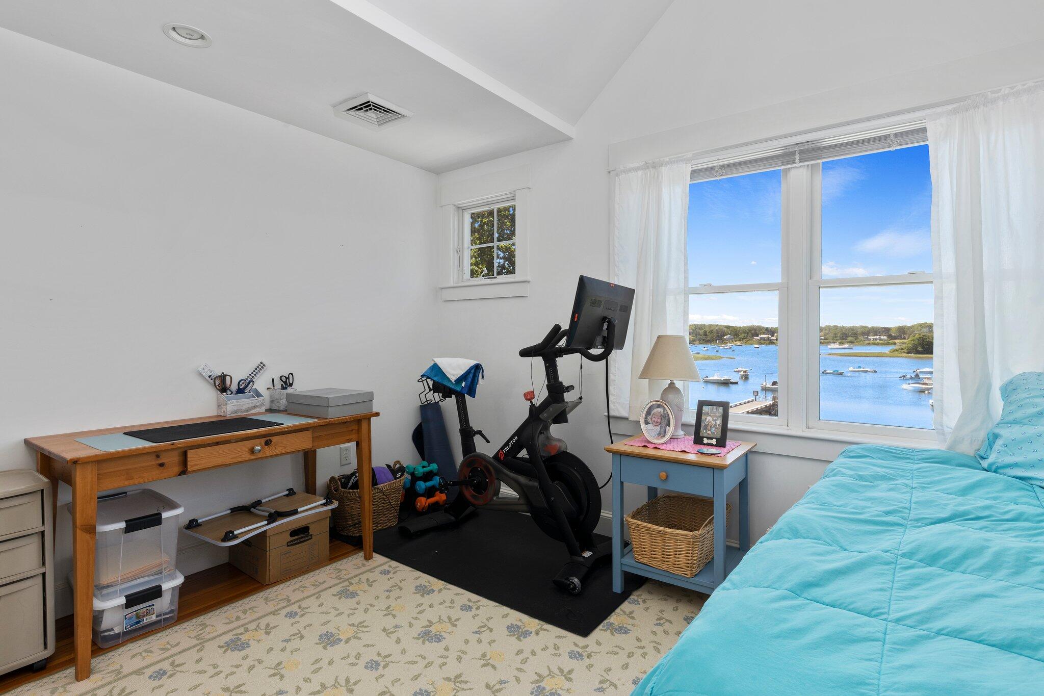 81 Mill Pond Road Chatham, MA 02633 - Photo 26 of 59 a room with furniture and a flat screen tv