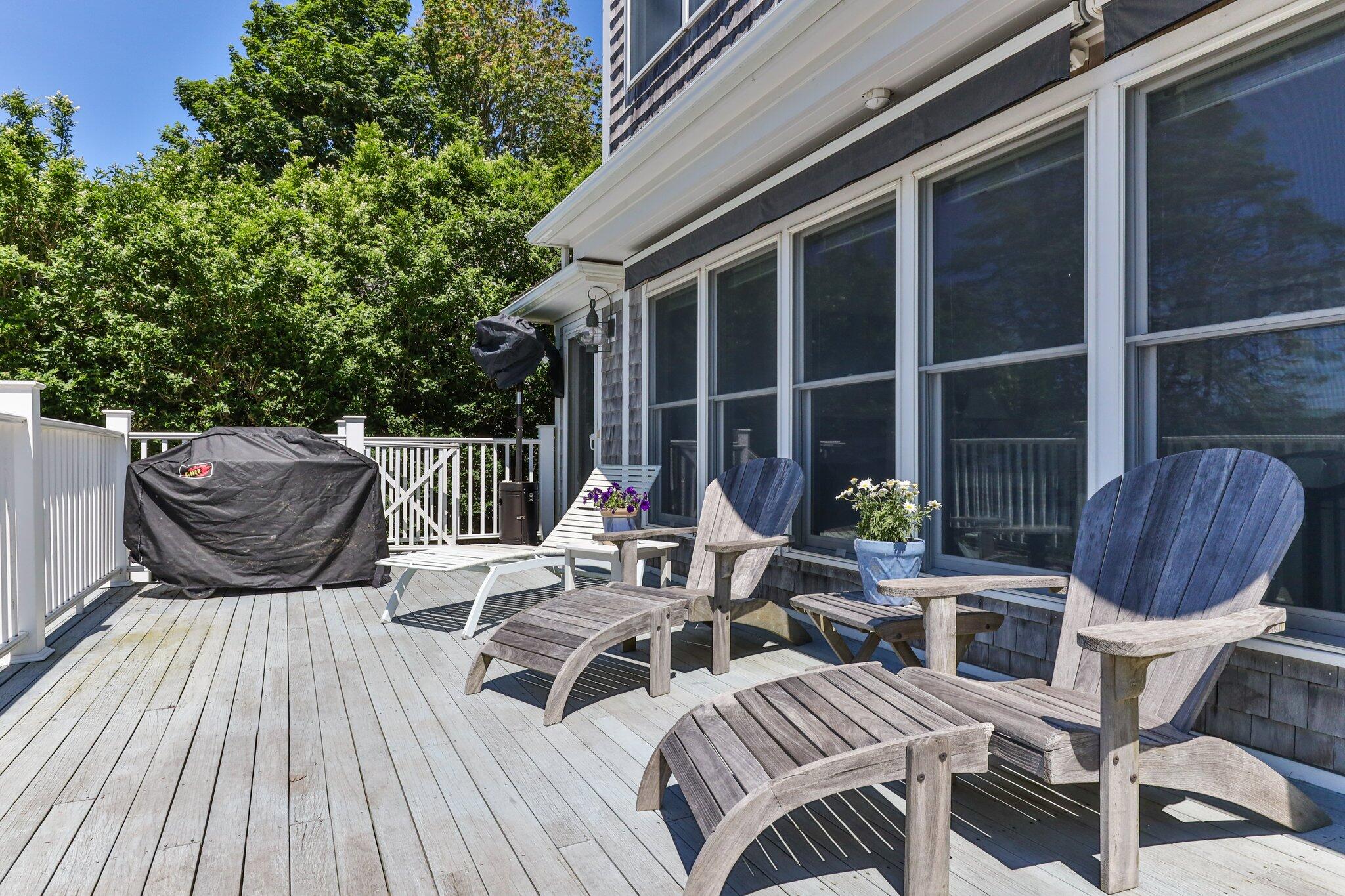 81 Mill Pond Road Chatham, MA 02633 - Photo 29 of 59 a view of outdoor sitting area with furniture and wooden floor
