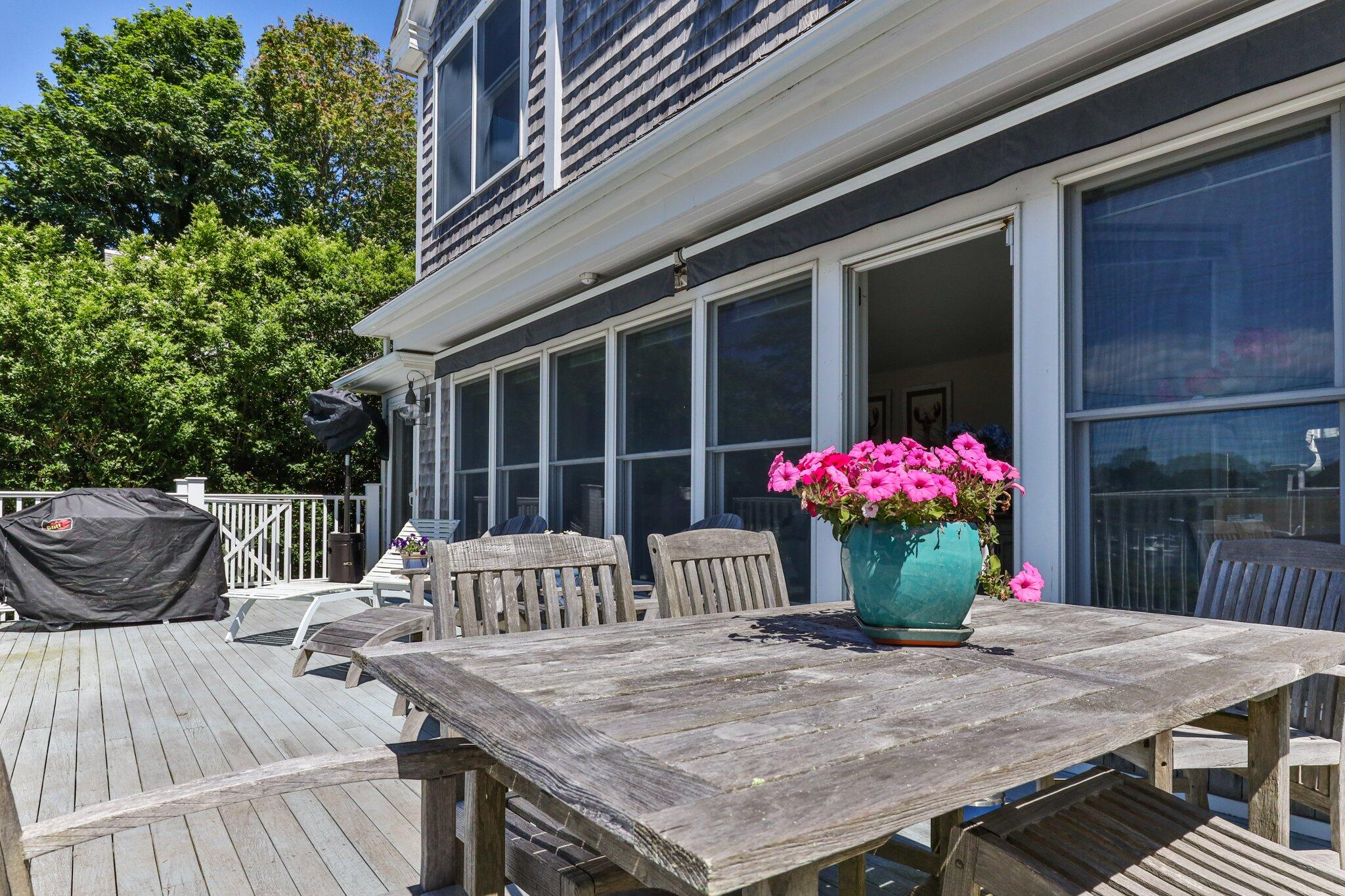 81 Mill Pond Road Chatham, MA 02633 - Photo 31 of 59 a view of a table and chair in the patio