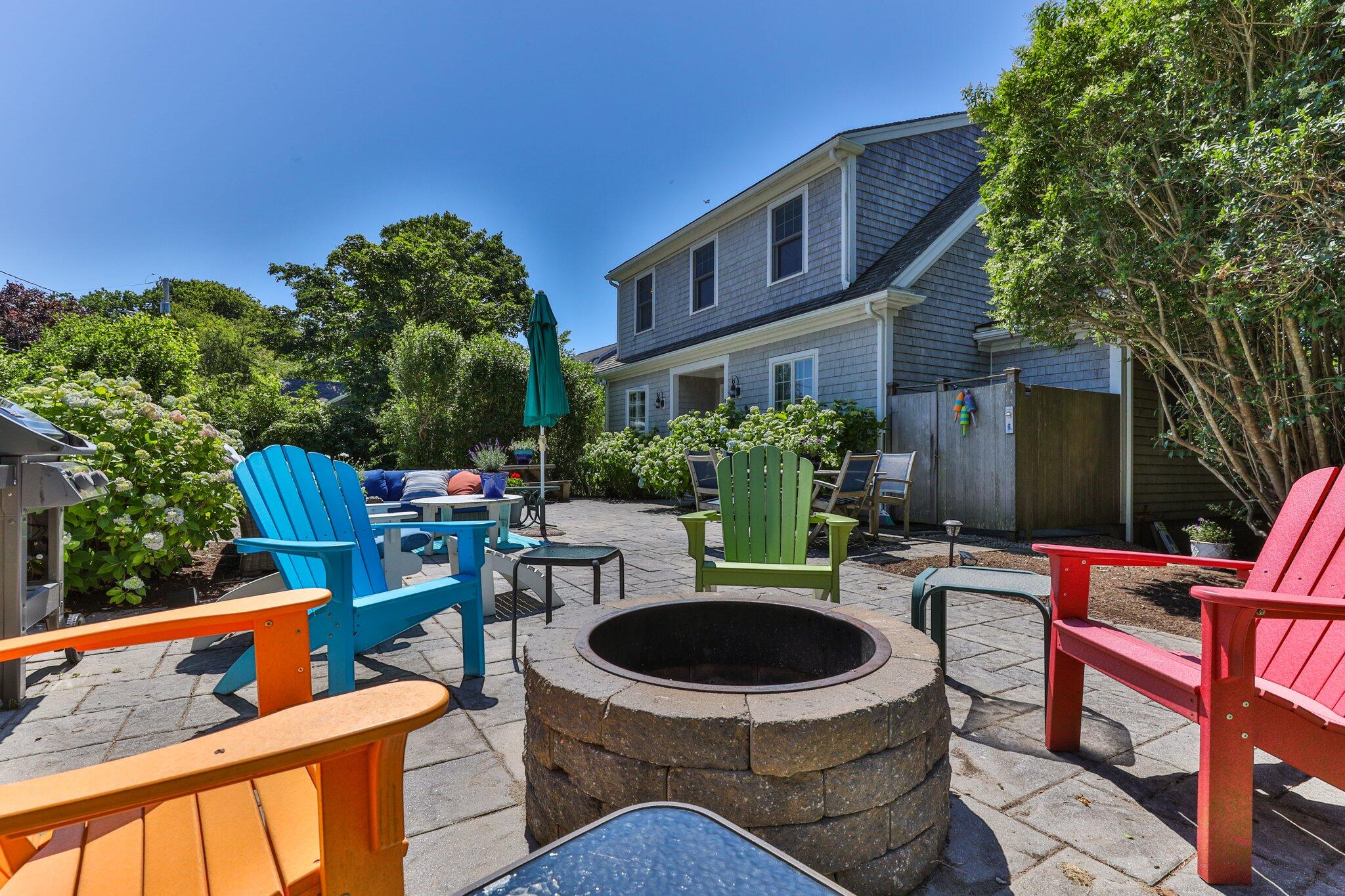 81 Mill Pond Road Chatham, MA 02633 - Photo 39 of 59 a view of an outdoor sitting area with furniture and swimming pool