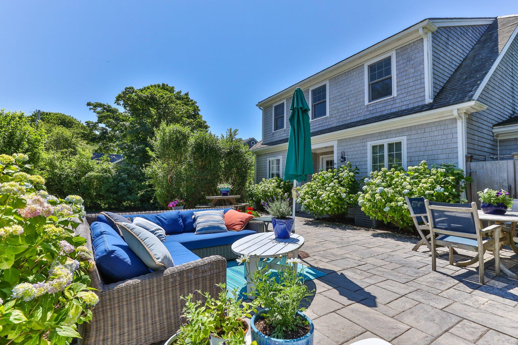 81 Mill Pond Road Chatham, MA 02633 - Photo 40 of 59 a view of backyard with outdoor seating and plants