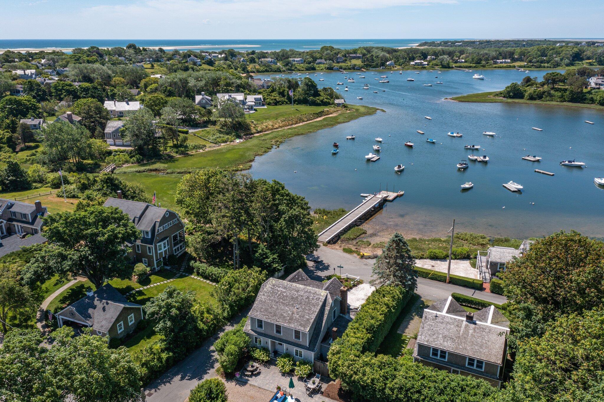 81 Mill Pond Road Chatham, MA 02633 - Photo 43 of 59 an aerial view of a house with a lake view