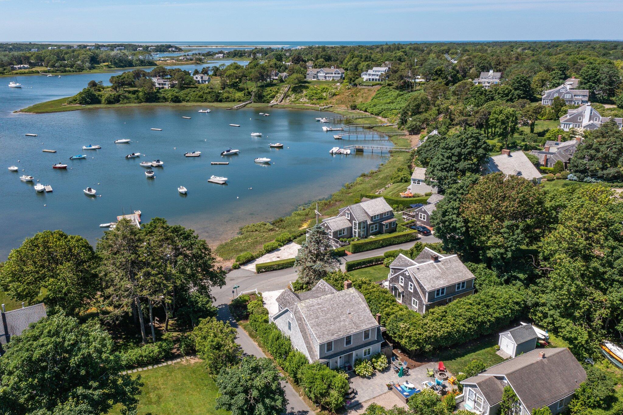 81 Mill Pond Road Chatham, MA 02633 - Photo 44 of 59 an aerial view of a house with a lake view