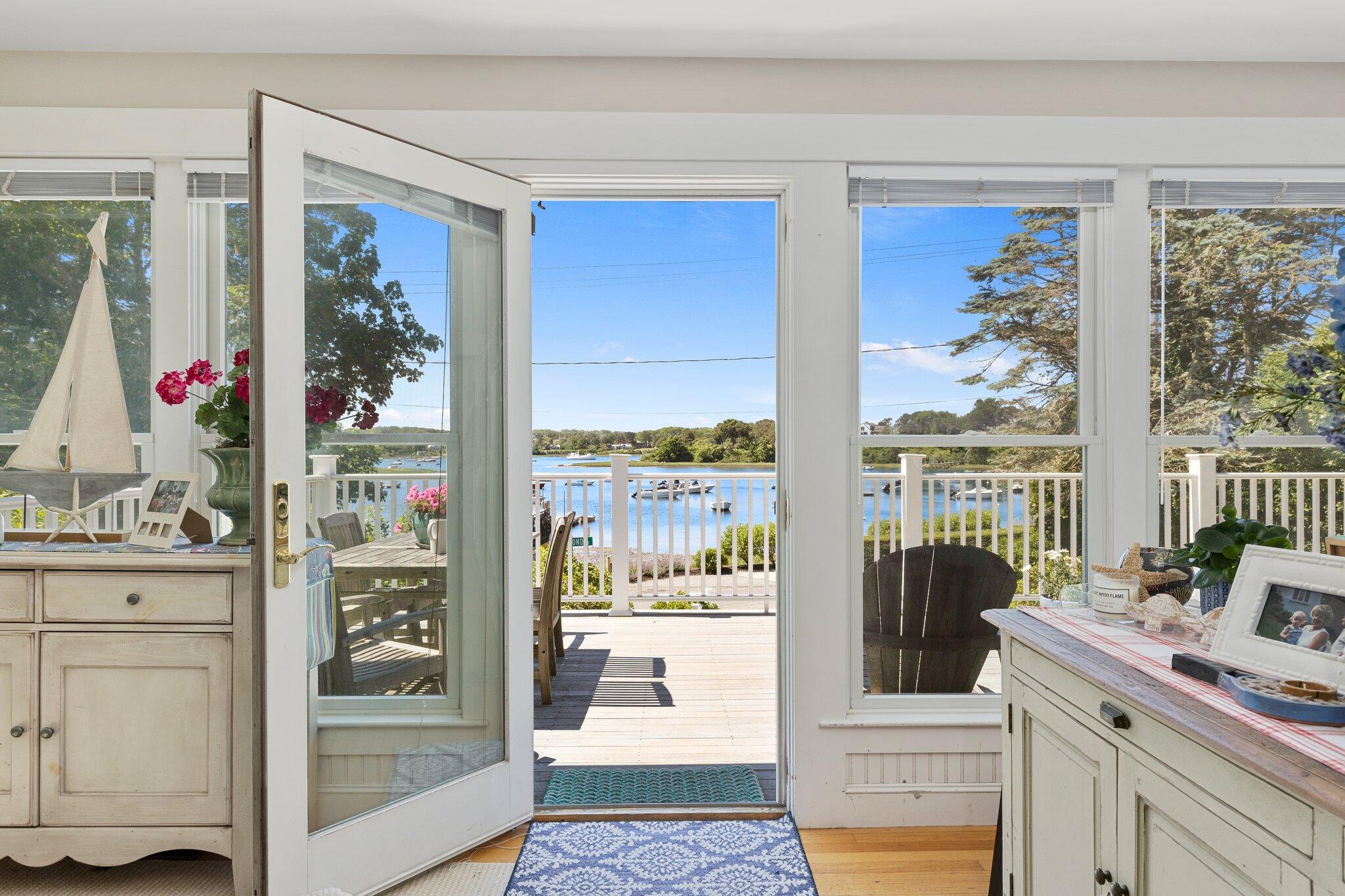 81 Mill Pond Road Chatham, MA 02633 - Photo 10 of 59 a very nice looking living room with a large window and kitchen view