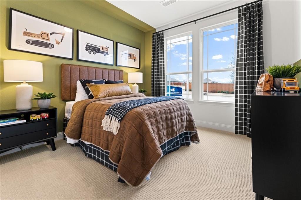 1435 Canadian Lane Van Alstyne, TX 75495 - Photo 14 of 16 a bedroom with a bed lamp and a large window