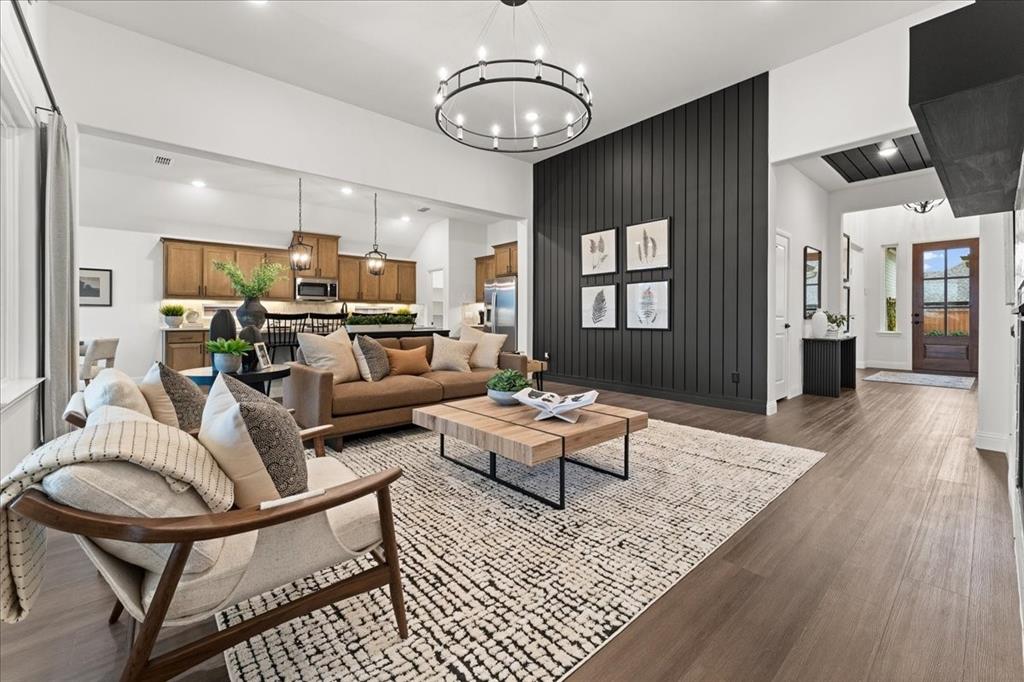 1435 Canadian Lane Van Alstyne, TX 75495 - Photo 2 of 16 a living room with furniture or couch and a chandelier