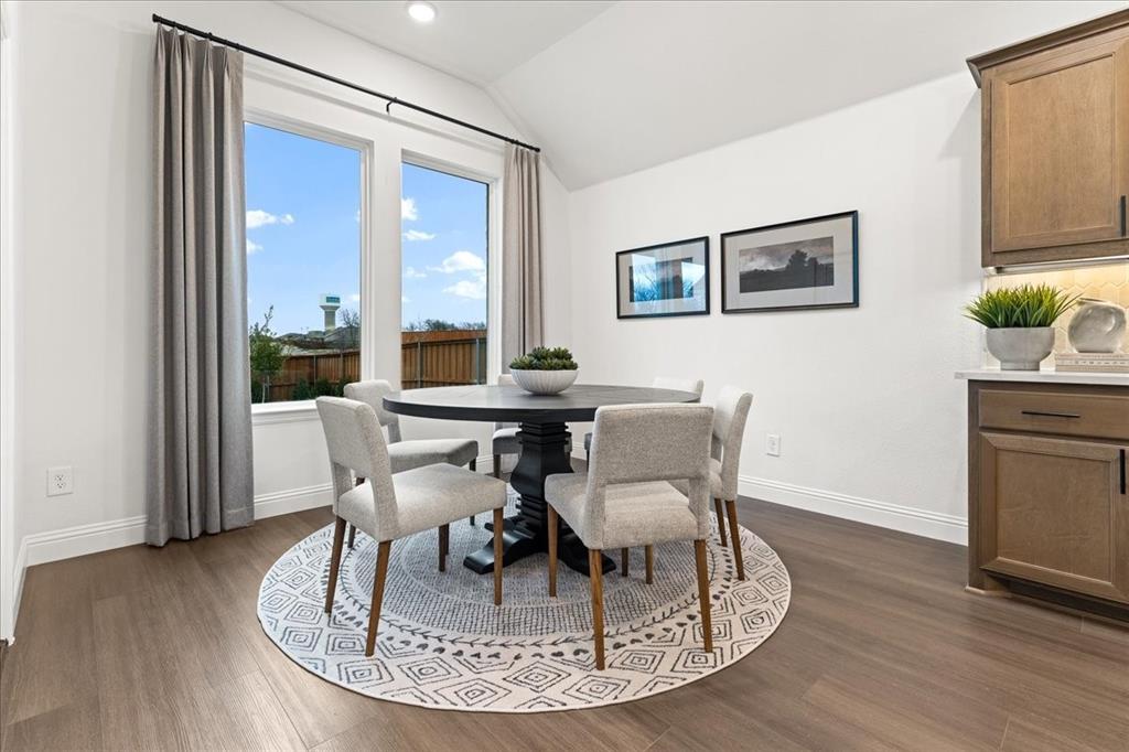 1435 Canadian Lane Van Alstyne, TX 75495 - Photo 6 of 16 a dining room with furniture a window and wooden floor