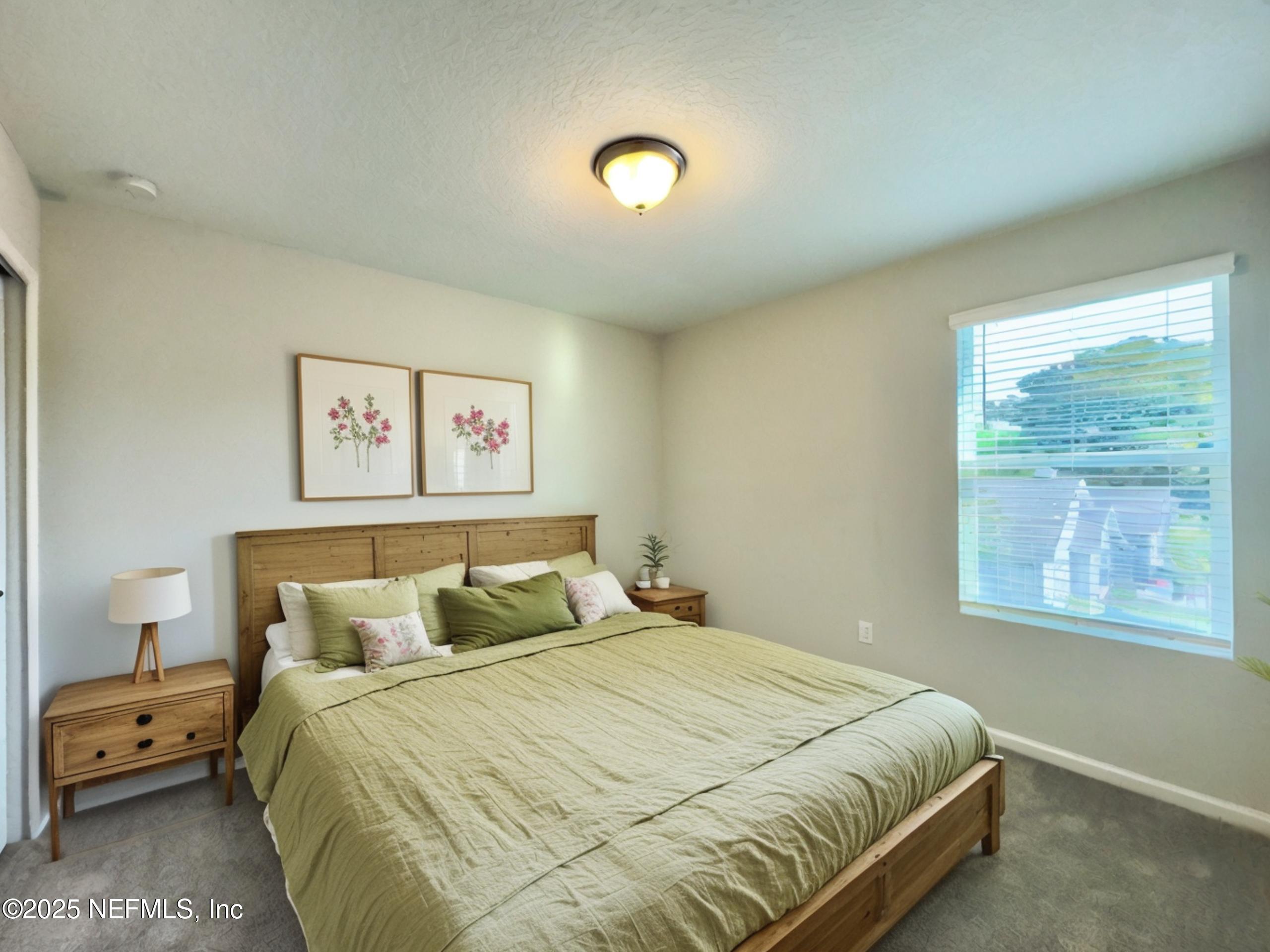 4672 Ribault Park Street Jacksonville, FL 32233 - Photo 16 of 22 a bedroom with a bed and a window