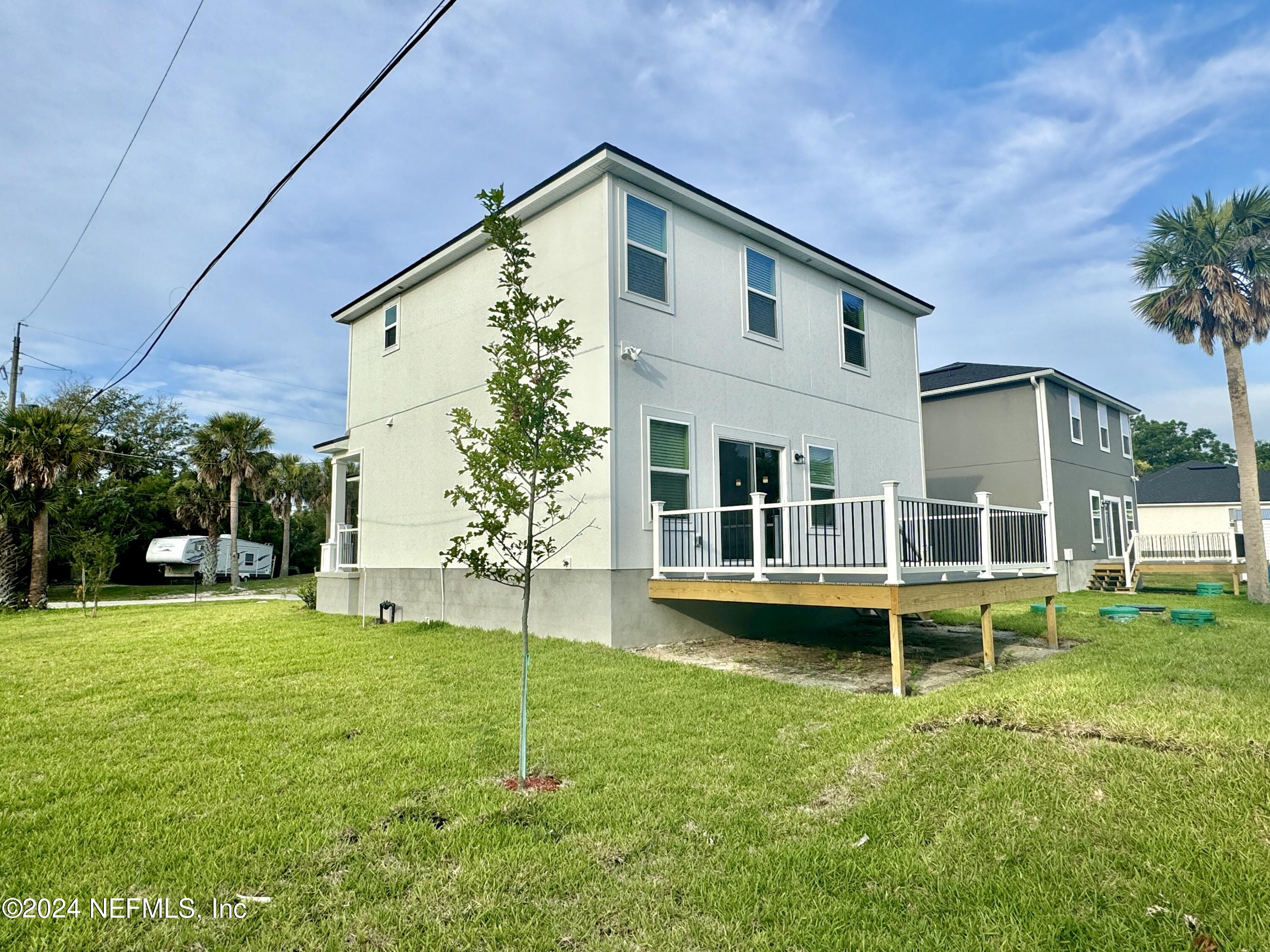 4672 Ribault Park Street Jacksonville, FL 32233 - Photo 21 of 22 a view of a house with a backyard porch and sitting area