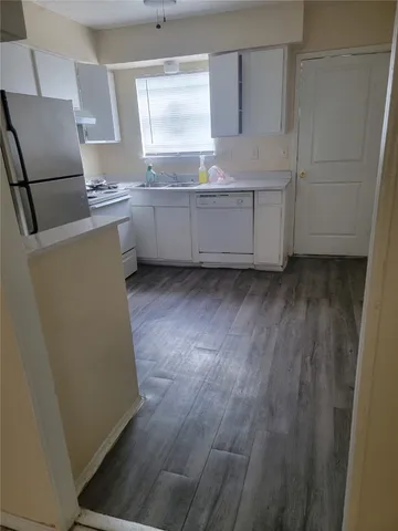 a room with cabinets and window