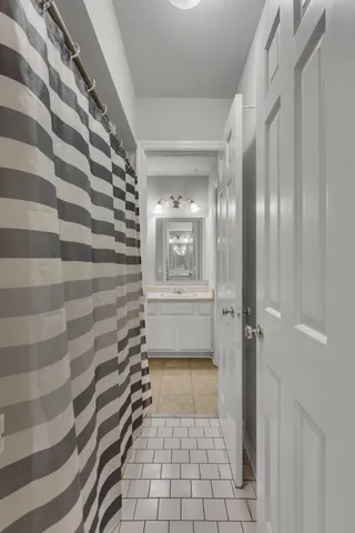 a bathroom with a shower and a toilet