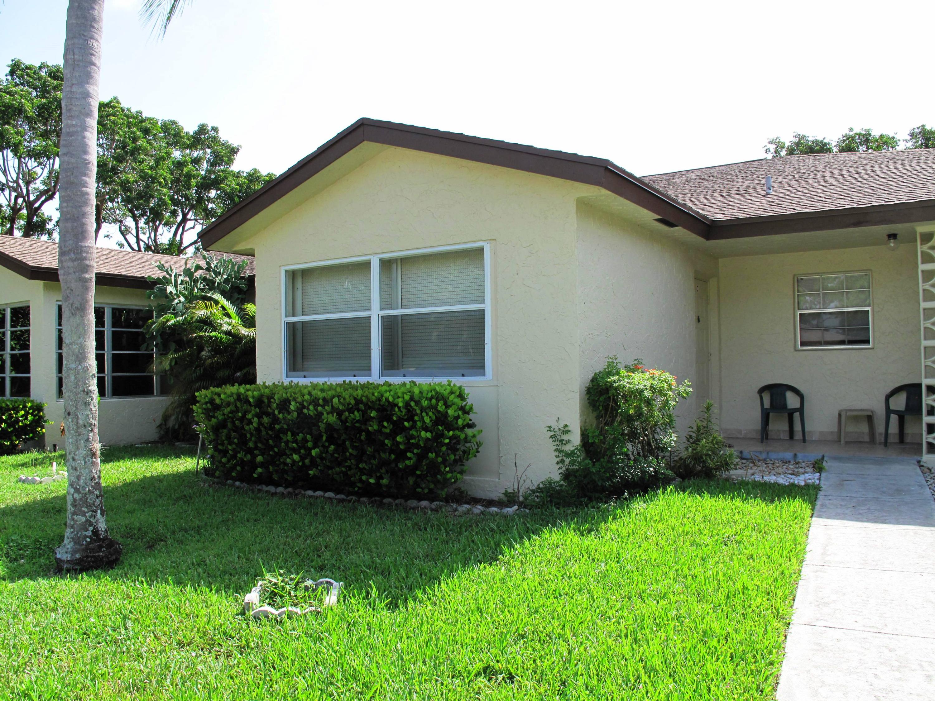 5220 Nesting Way, Unit C Delray Beach, FL 33484 - Photo 1 of 32 Front view of villa