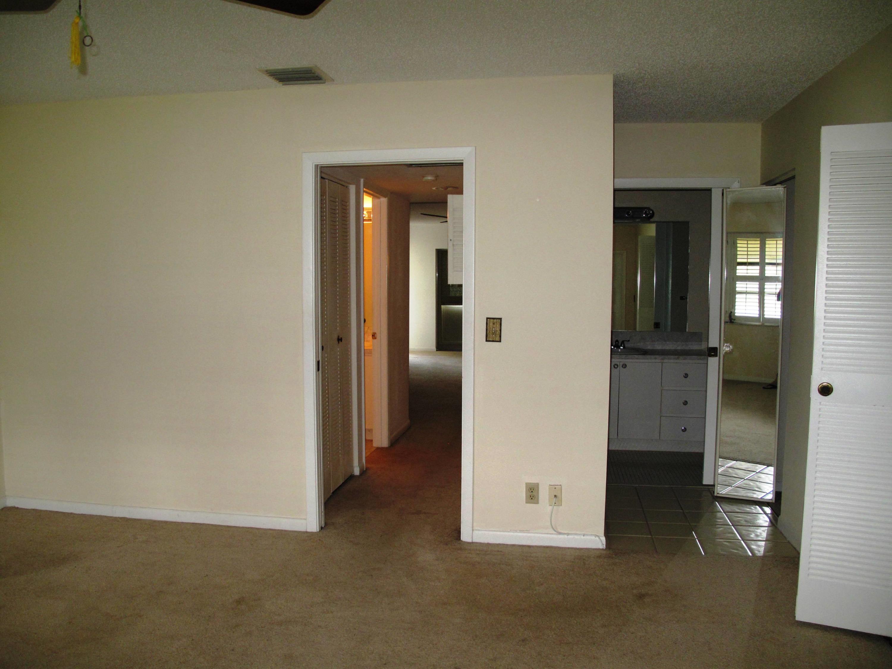 5220 Nesting Way, Unit C Delray Beach, FL 33484 - Photo 20 of 32 Master bedroom with 2 huge walk in clos
