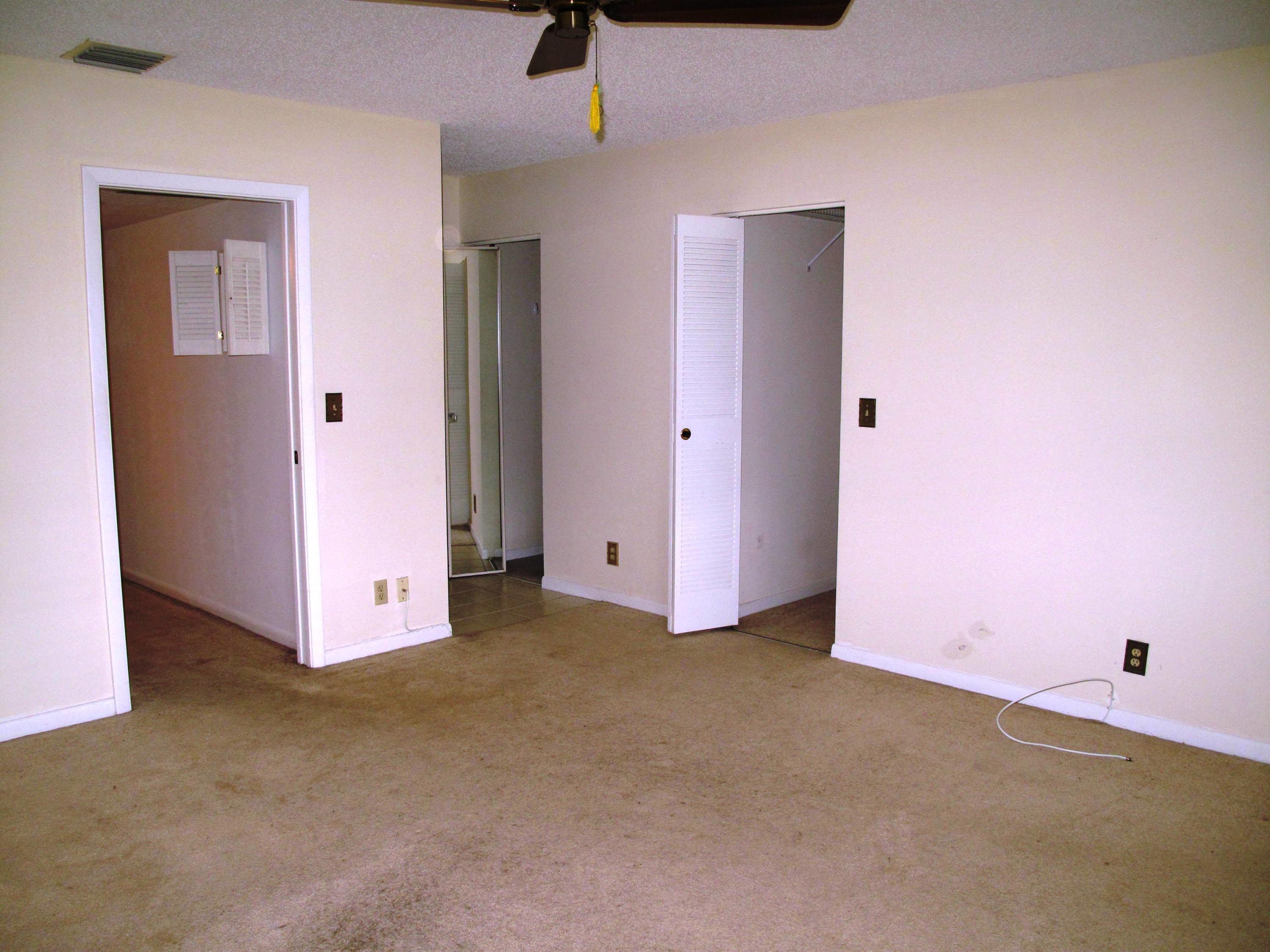5220 Nesting Way, Unit C Delray Beach, FL 33484 - Photo 22 of 32 Master bedroom with walk in closets