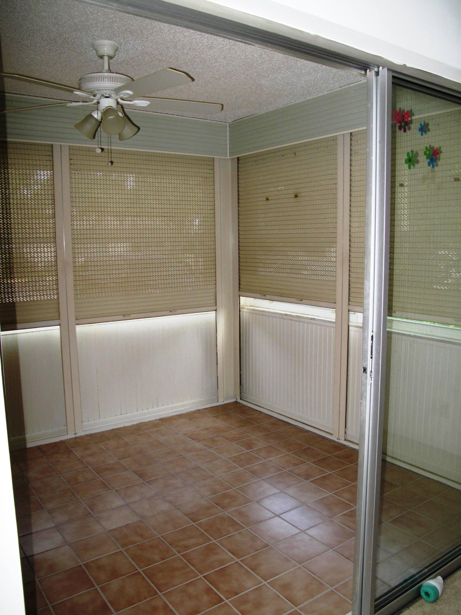 5220 Nesting Way, Unit C Delray Beach, FL 33484 - Photo 3 of 32 Enclosed Florida room (2)