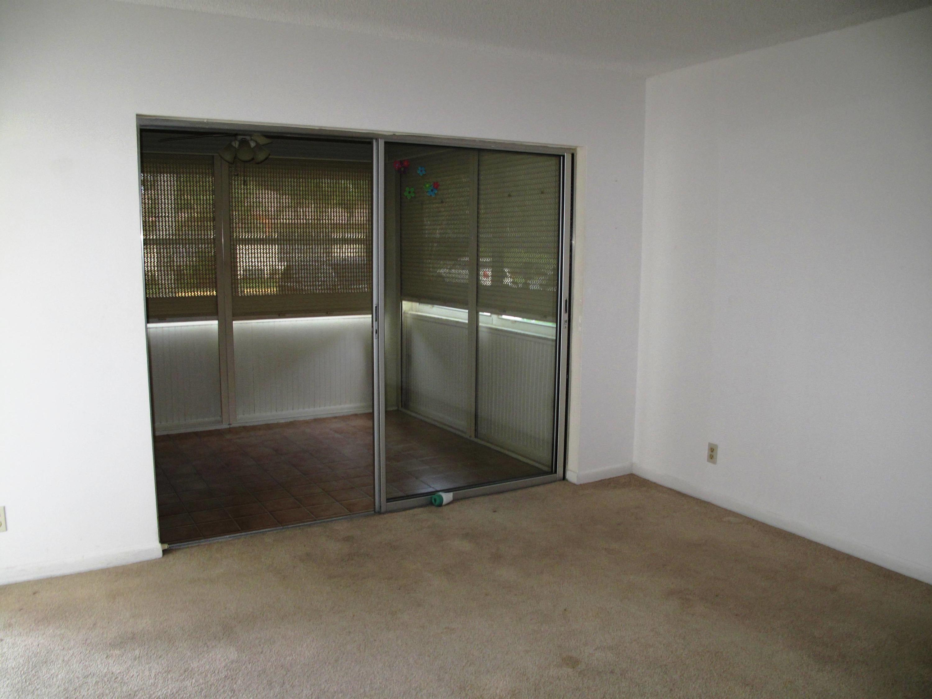5220 Nesting Way, Unit C Delray Beach, FL 33484 - Photo 4 of 32 Enclosed Florida room (1)