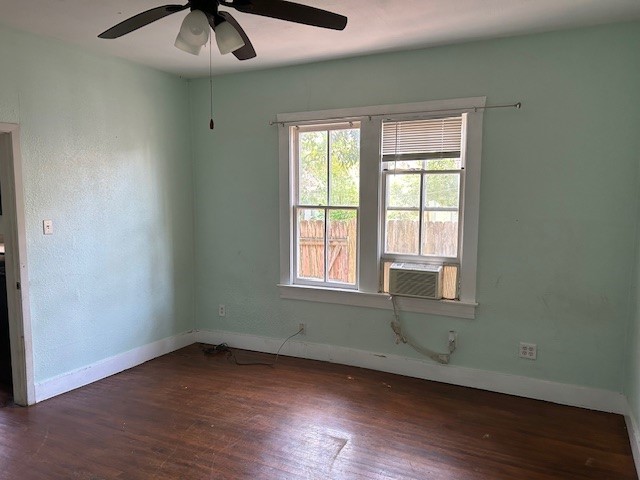4725 Avenue R 1/2 Galveston, TX 77551 - Photo 6 of 18 an empty room with wooden floor and windows