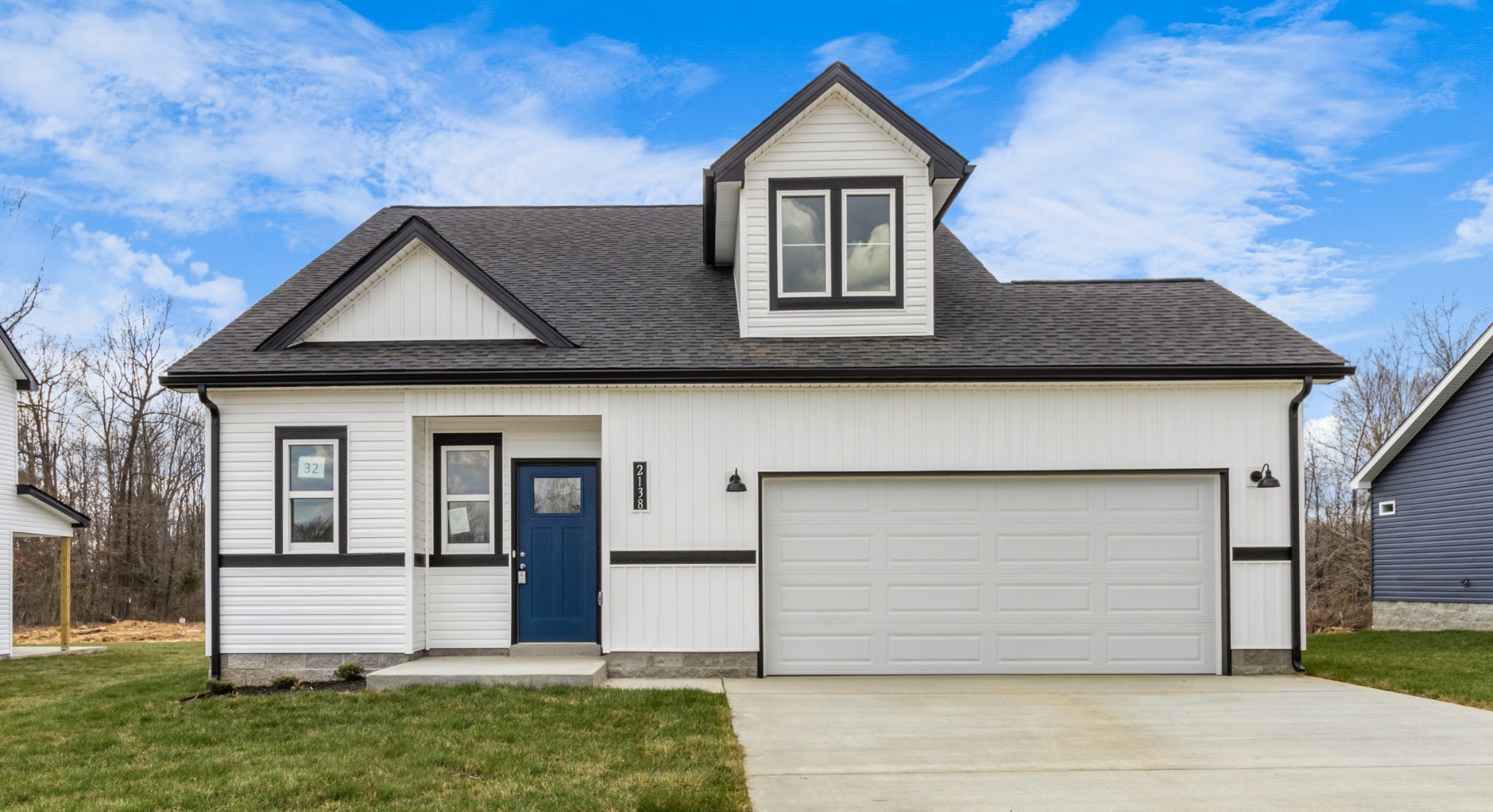 2138 Ireland Way Clarksville, TN 37042 - Photo 1 of 37 a front view of a house with a yard and garage