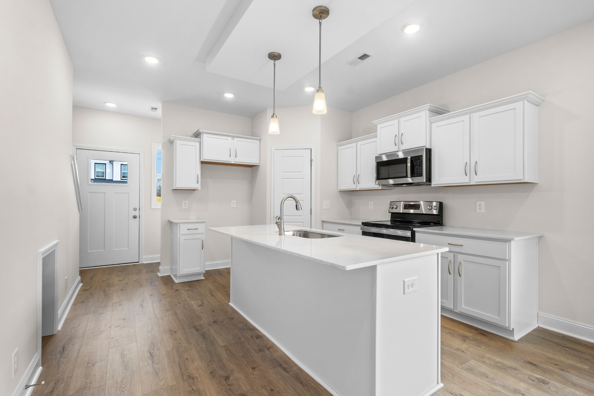 2138 Ireland Way Clarksville, TN 37042 - Photo 11 of 37 a kitchen with a sink a counter top space stainless steel appliances and cabinets