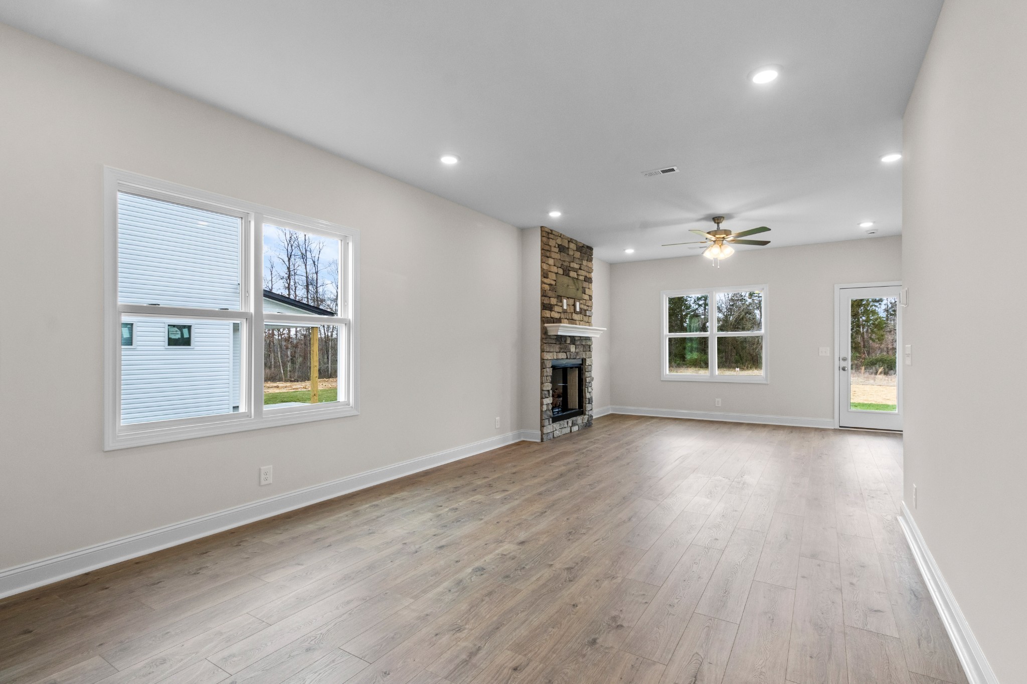 2138 Ireland Way Clarksville, TN 37042 - Photo 14 of 37 an empty room with wooden floor and windows