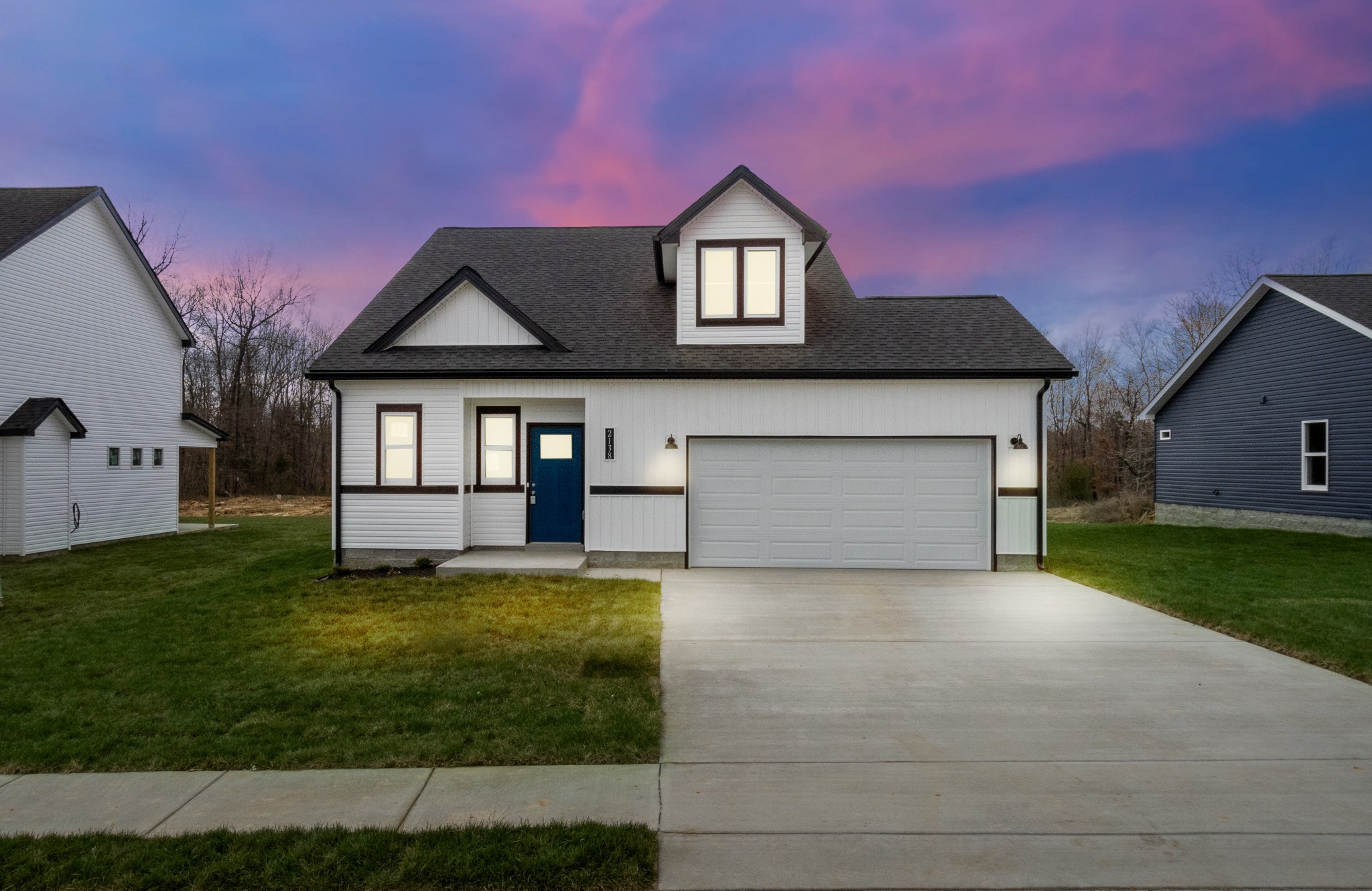 2138 Ireland Way Clarksville, TN 37042 - Photo 2 of 37 a front view of a house with a yard and garage