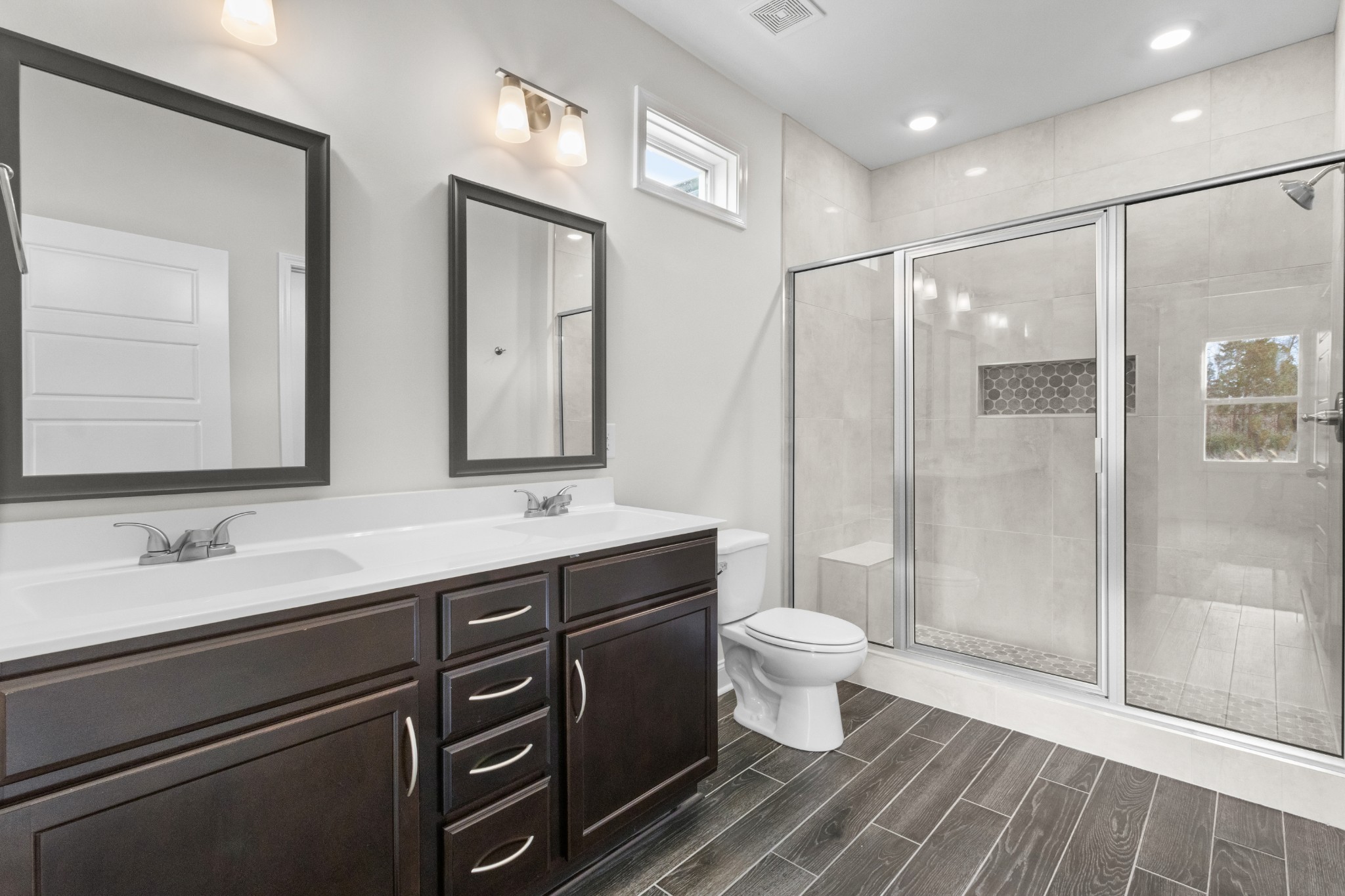 2138 Ireland Way Clarksville, TN 37042 - Photo 22 of 37 a bathroom with a double vanity sink toilet and shower