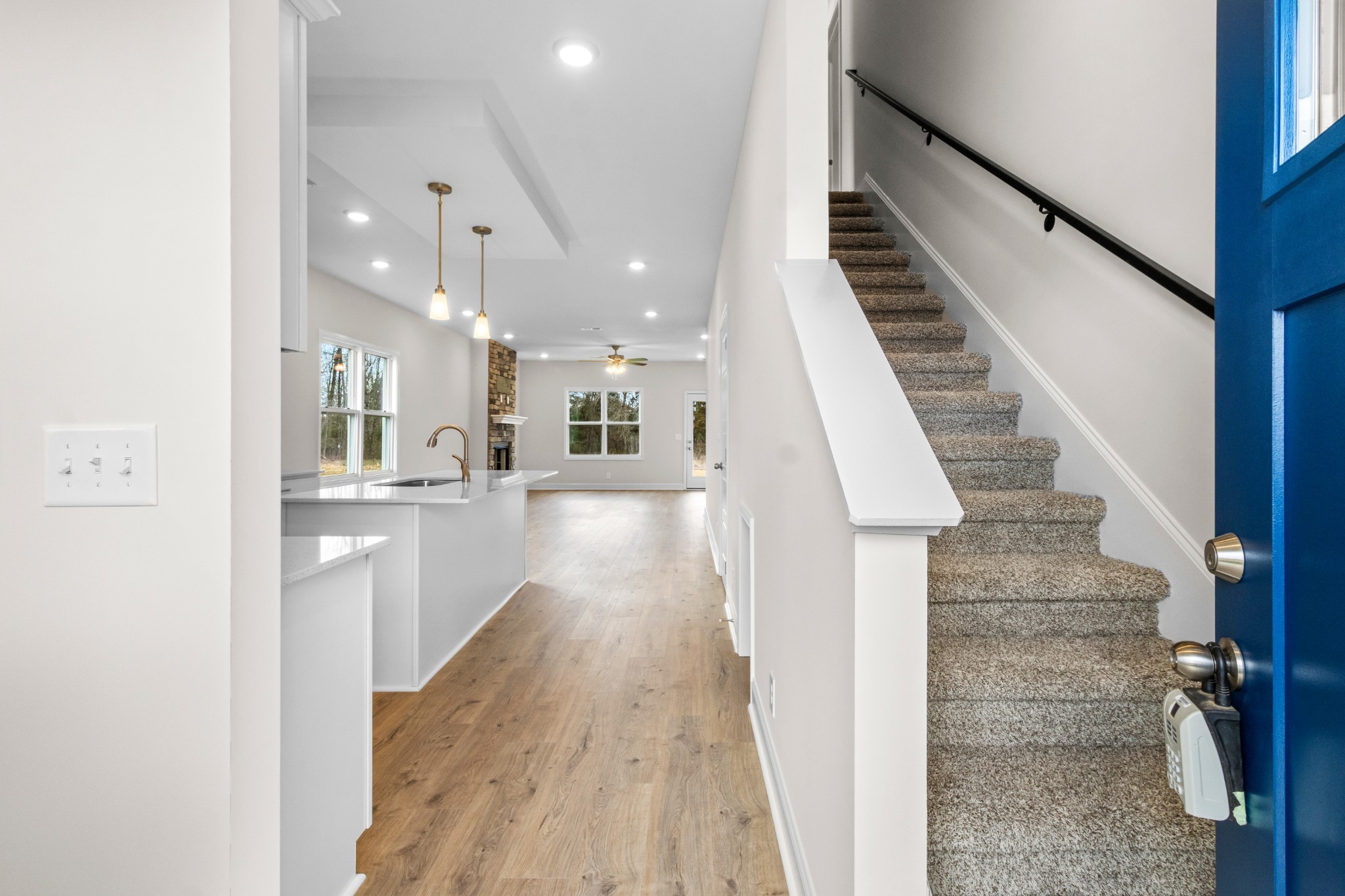 2138 Ireland Way Clarksville, TN 37042 - Photo 9 of 37 a view of a kitchen with wooden floor and stairs