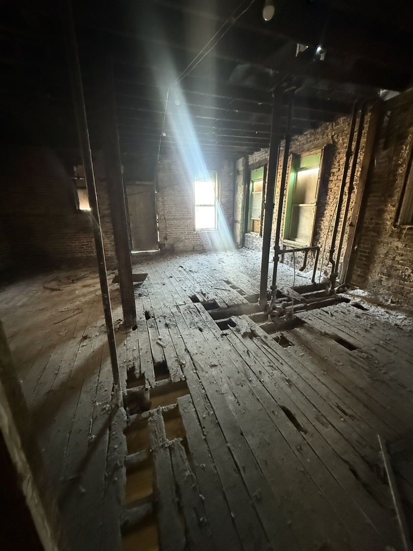 3600 West 16th Street Chicago, IL 60623 - Photo 16 of 21 a view of a room with wooden floor