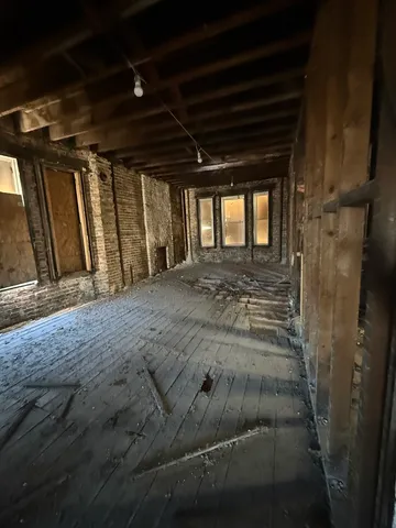 a view of an empty room with stairs