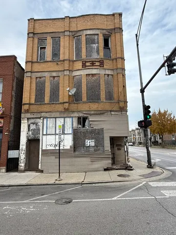 a view of a building with a street