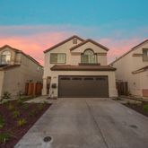 a front view of a house with yard