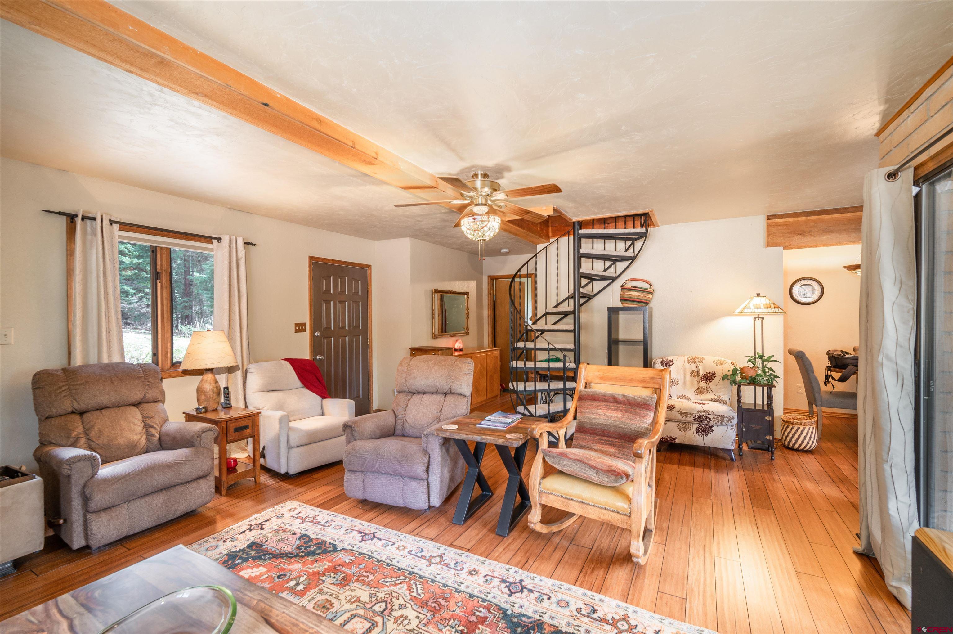 520 Los Ranchitos Drive Durango, CO 81301 - Photo 12 of 36 a living room with furniture and wooden floor