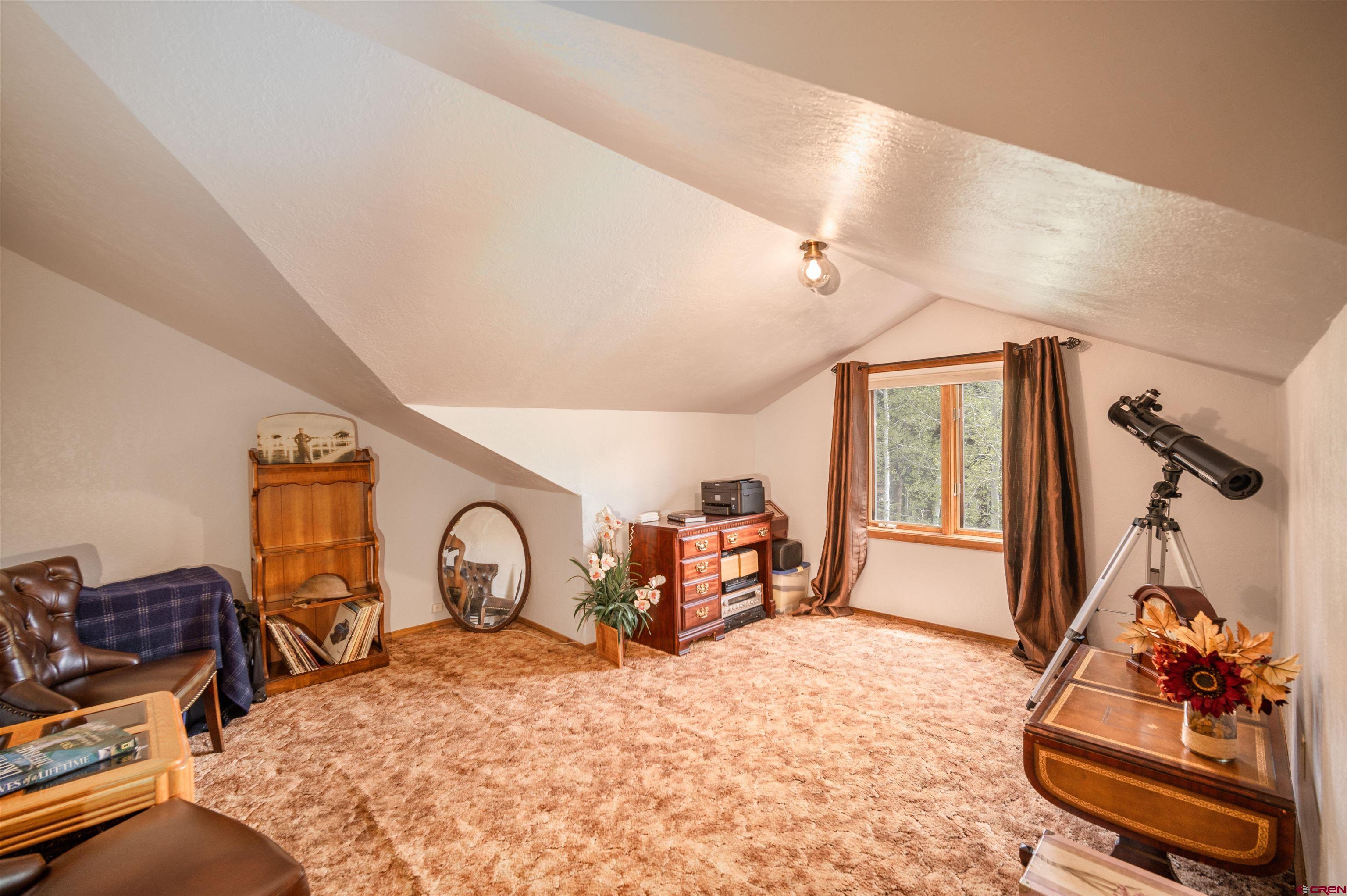 520 Los Ranchitos Drive Durango, CO 81301 - Photo 23 of 36 a bedroom with furniture and a window