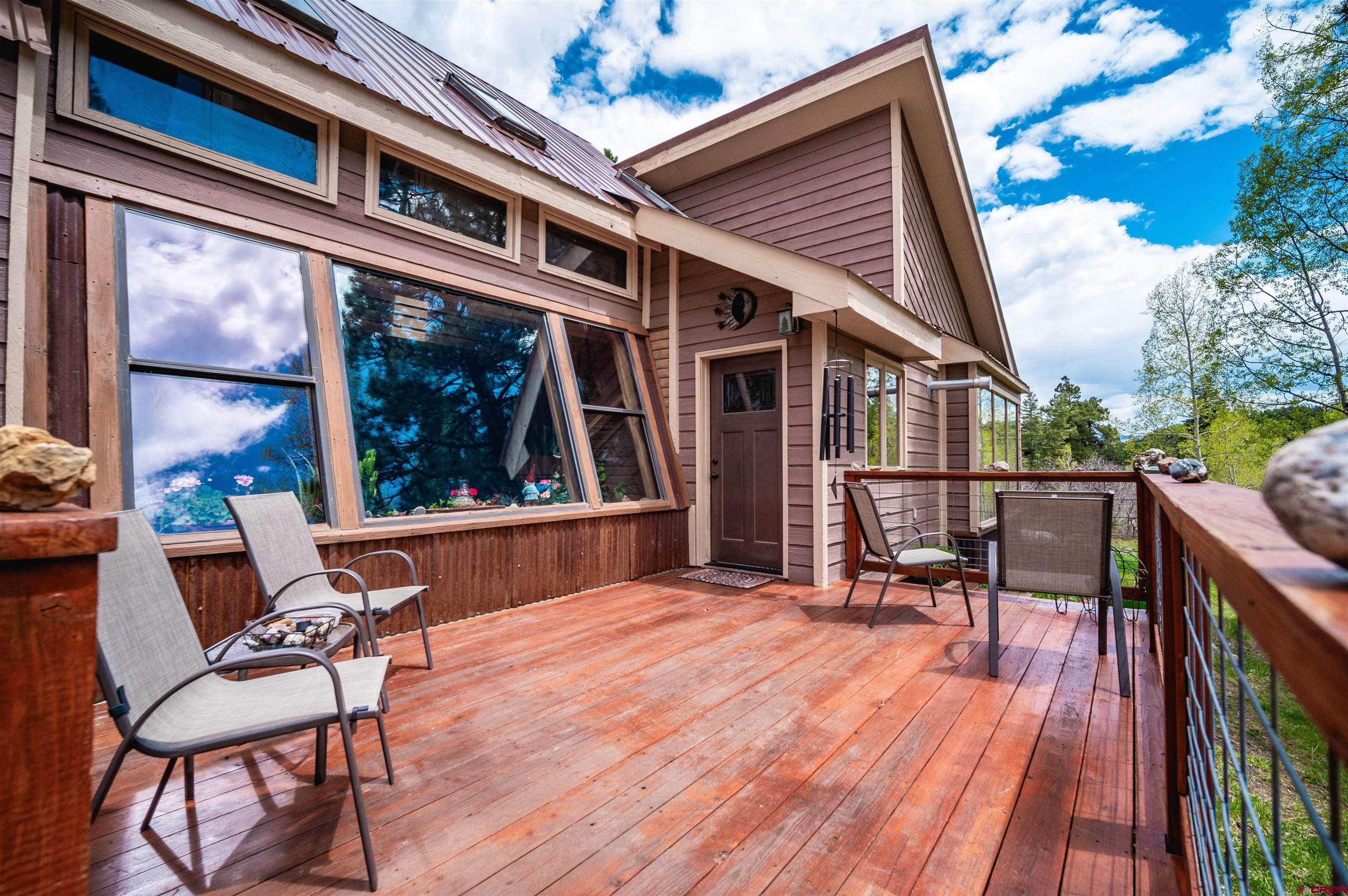 520 Los Ranchitos Drive Durango, CO 81301 - Photo 26 of 36 a balcony with wooden floor table and chairs