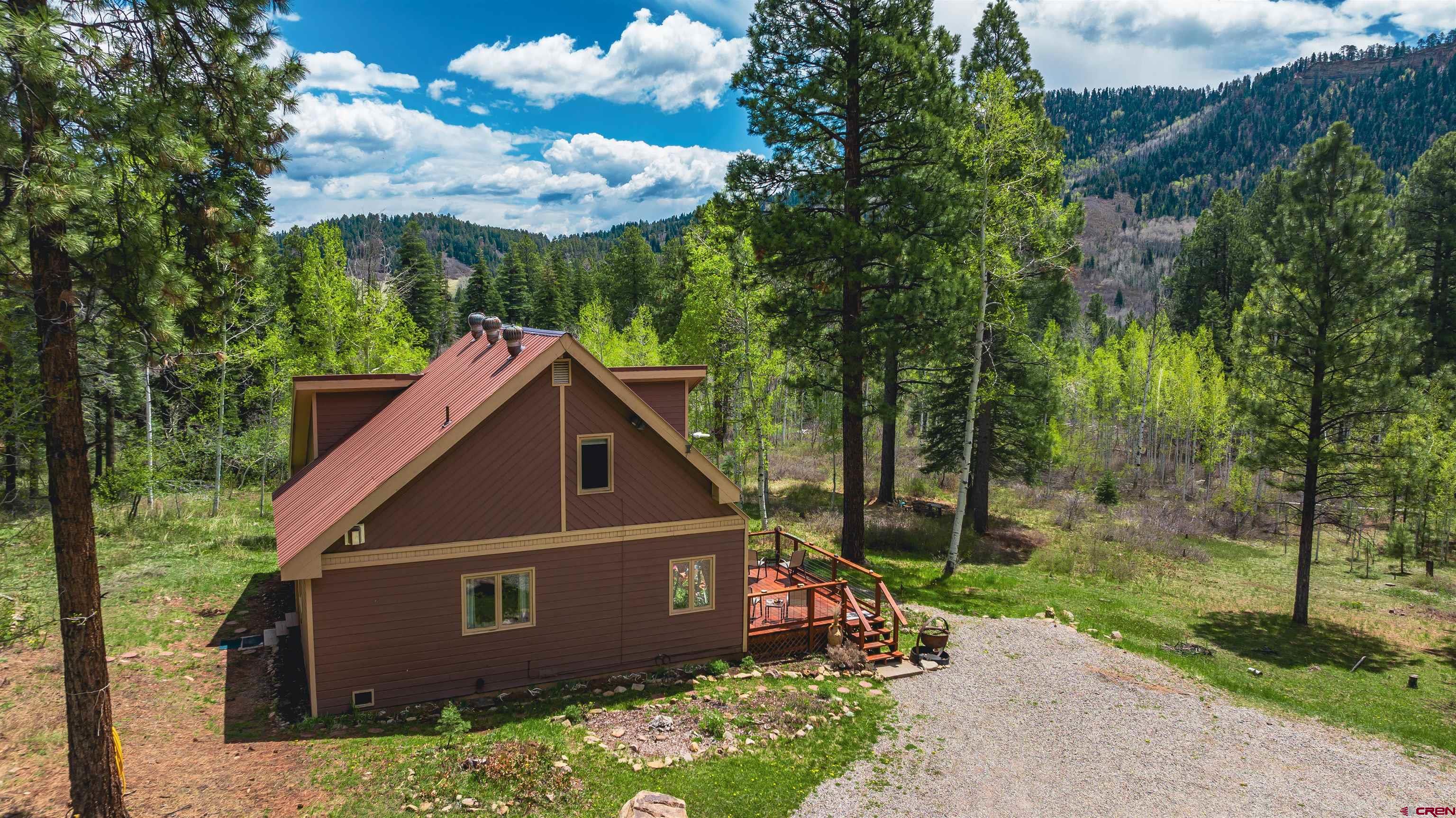 520 Los Ranchitos Drive Durango, CO 81301 - Photo 5 of 36 a front view of a house with garden