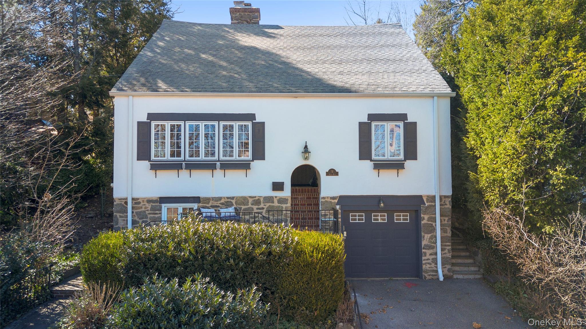 51 Valley Road Larchmont, NY 10538 - Photo 1 of 1 a front view of a house with garden