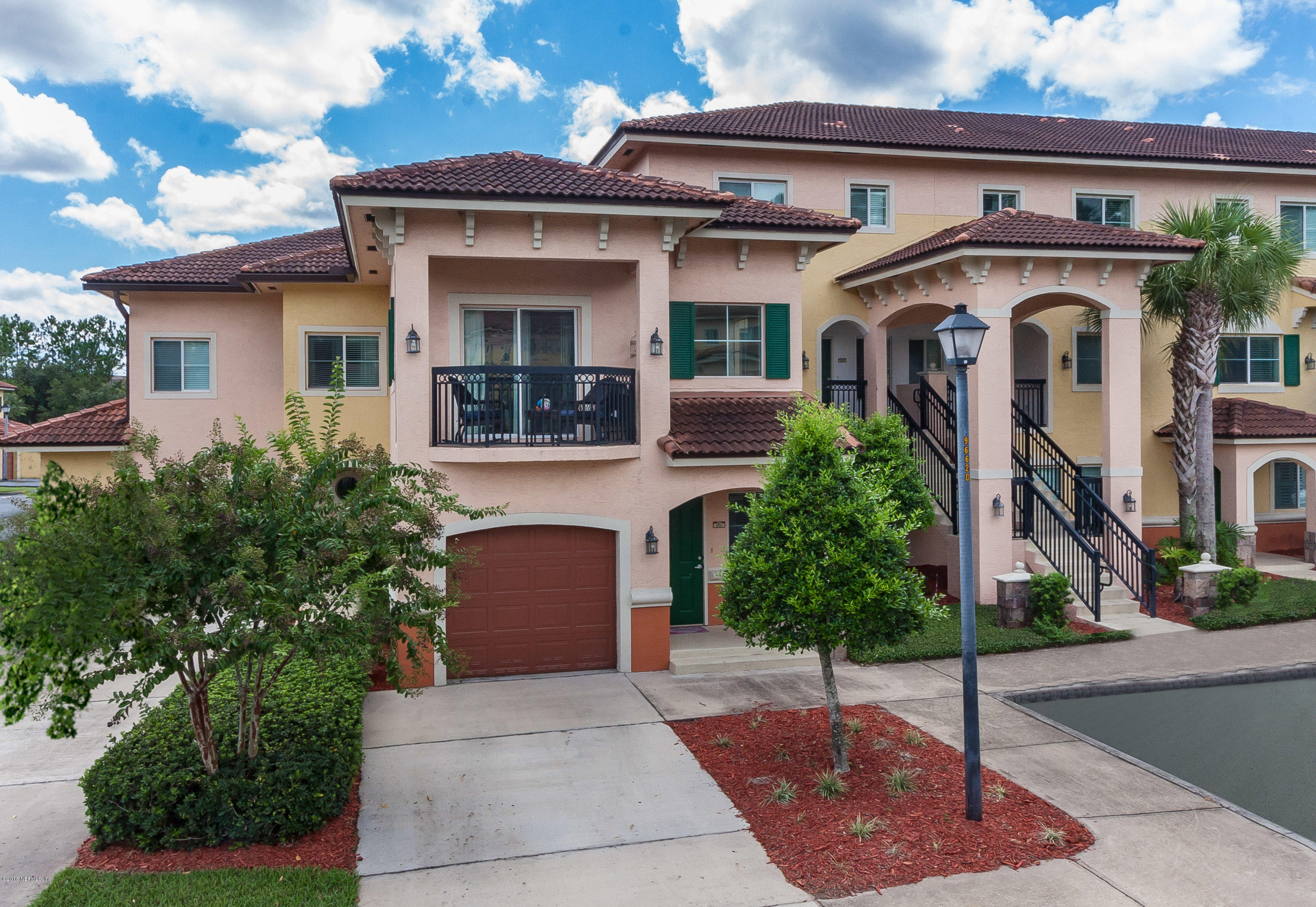 9745 Touchton Road, Unit 2521 Jacksonville, FL 32246 - Photo 1 of 31 a front view of a house with garden