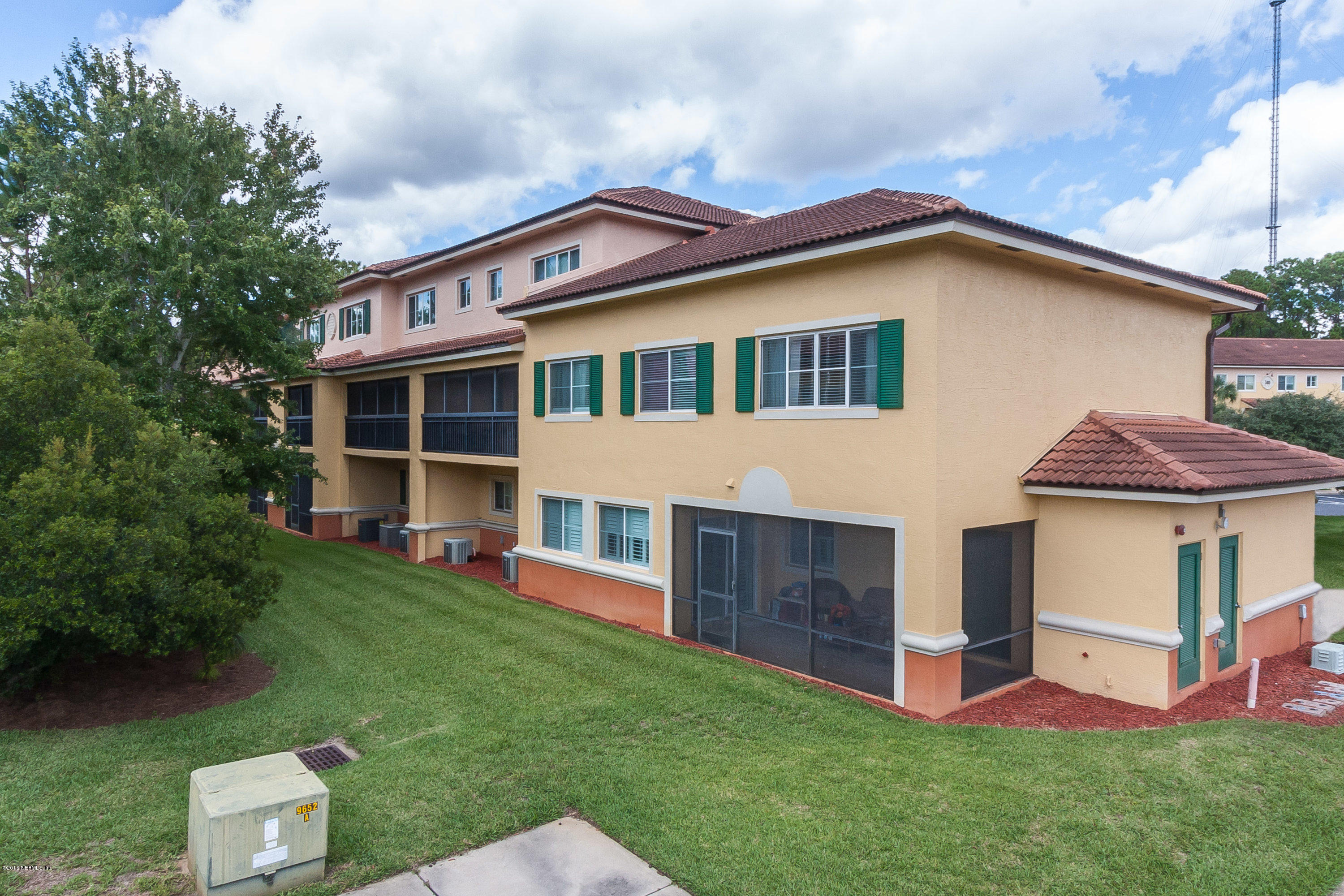 9745 Touchton Road, Unit 2521 Jacksonville, FL 32246 - Photo 16 of 31 a front view of a house with a garden and deck
