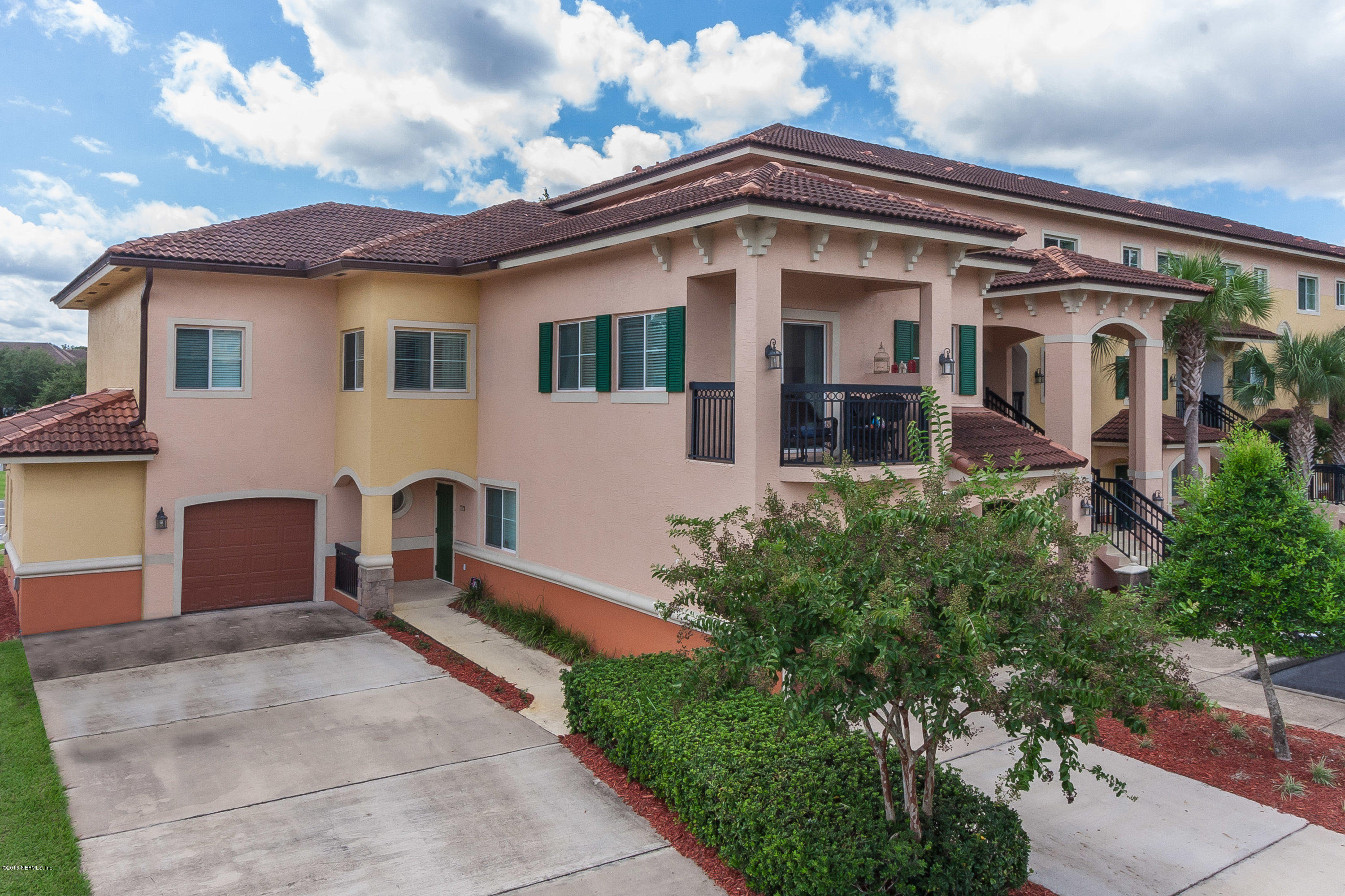 9745 Touchton Road, Unit 2521 Jacksonville, FL 32246 - Photo 17 of 31 a front view of a house with garden