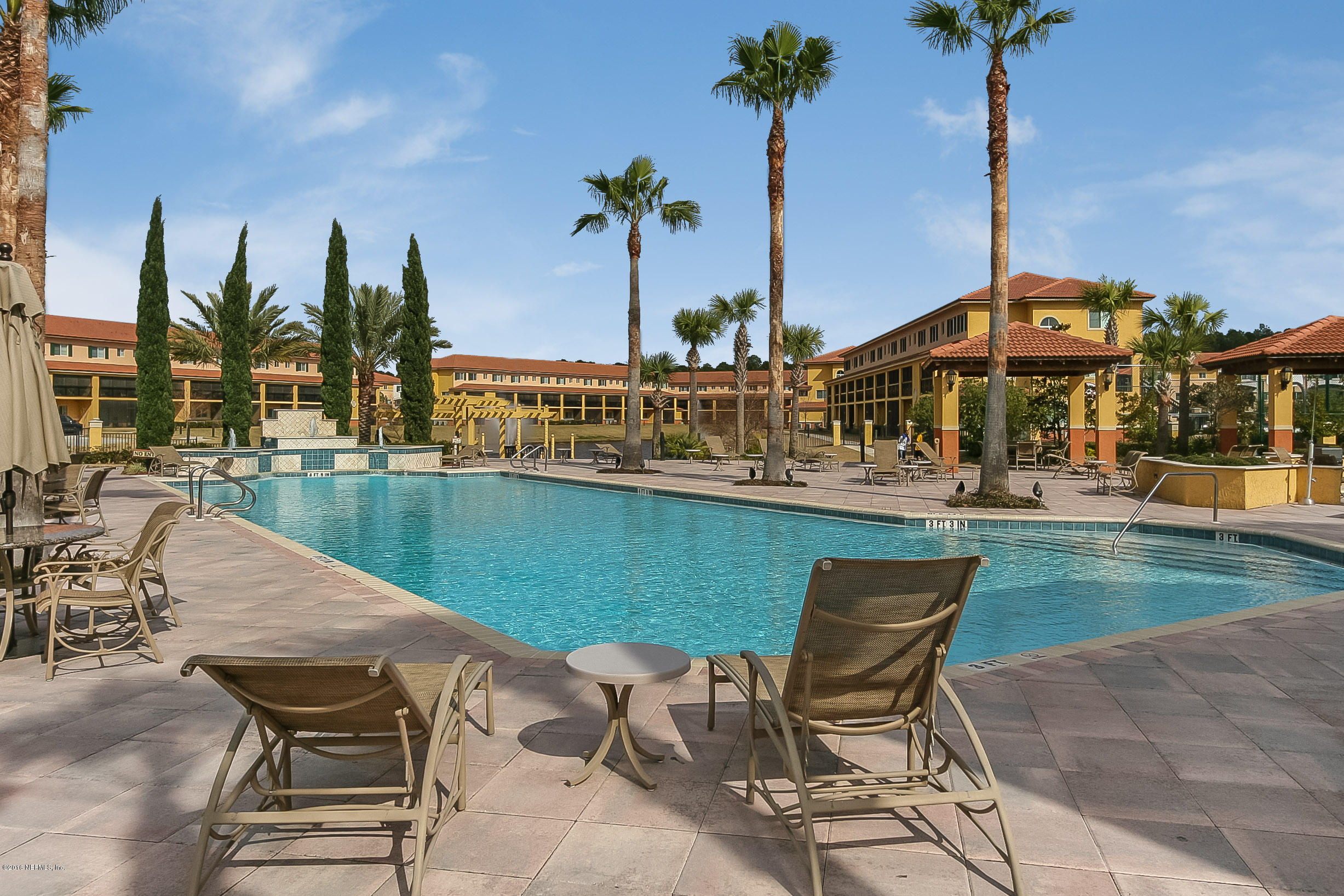 9745 Touchton Road, Unit 2521 Jacksonville, FL 32246 - Photo 23 of 31 a view of a lake with a table and chairs