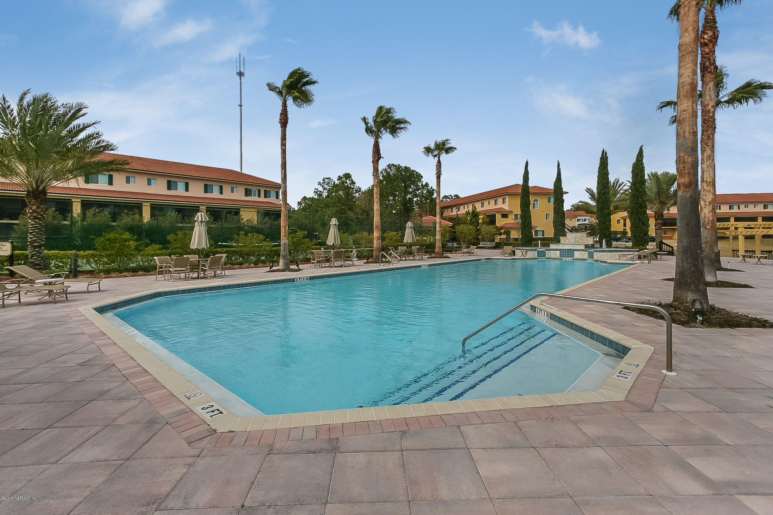 9745 Touchton Road, Unit 2521 Jacksonville, FL 32246 - Photo 24 of 31 a view of a swimming pool with a lawn chairs