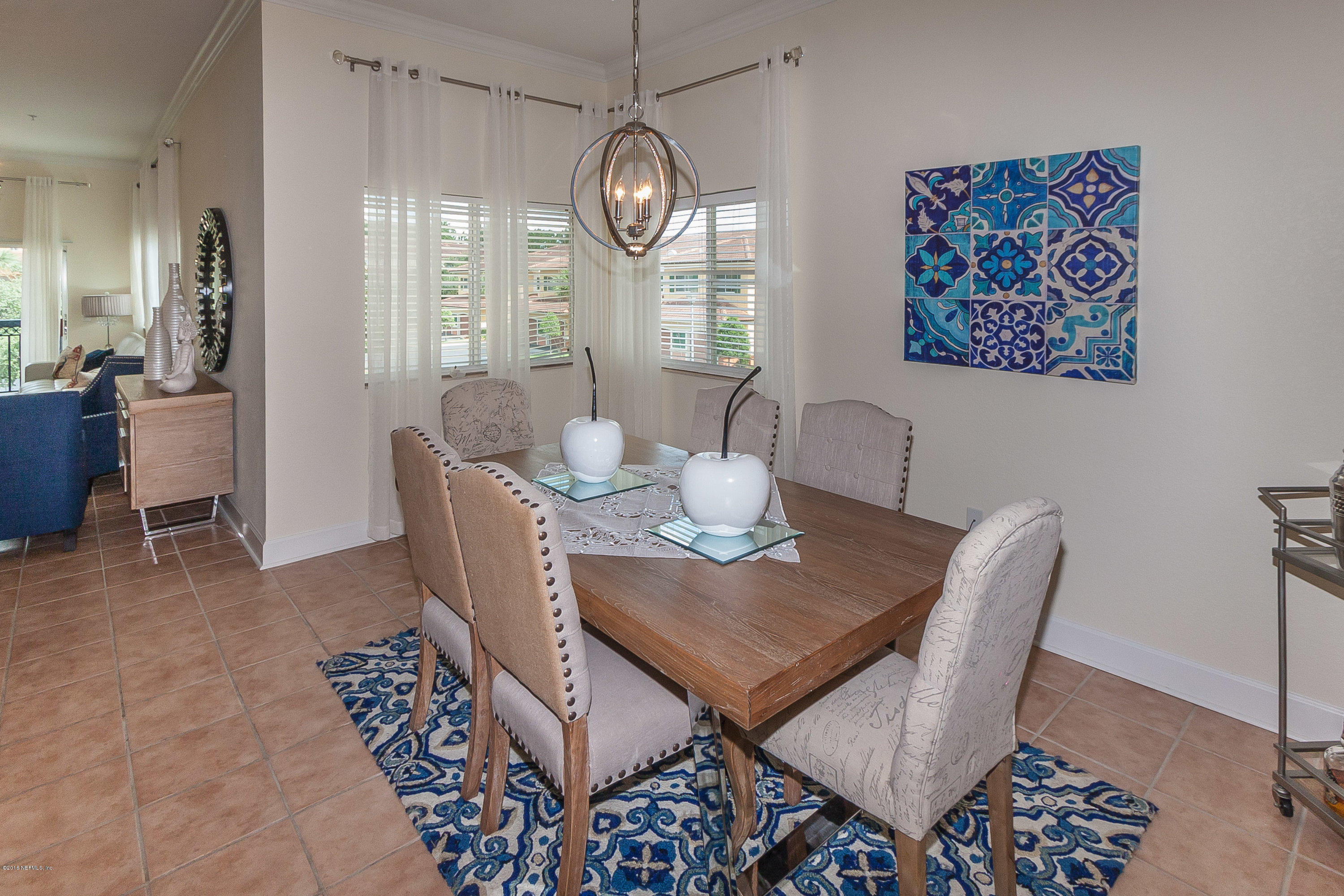 9745 Touchton Road, Unit 2521 Jacksonville, FL 32246 - Photo 6 of 31 a view of a dining room with furniture