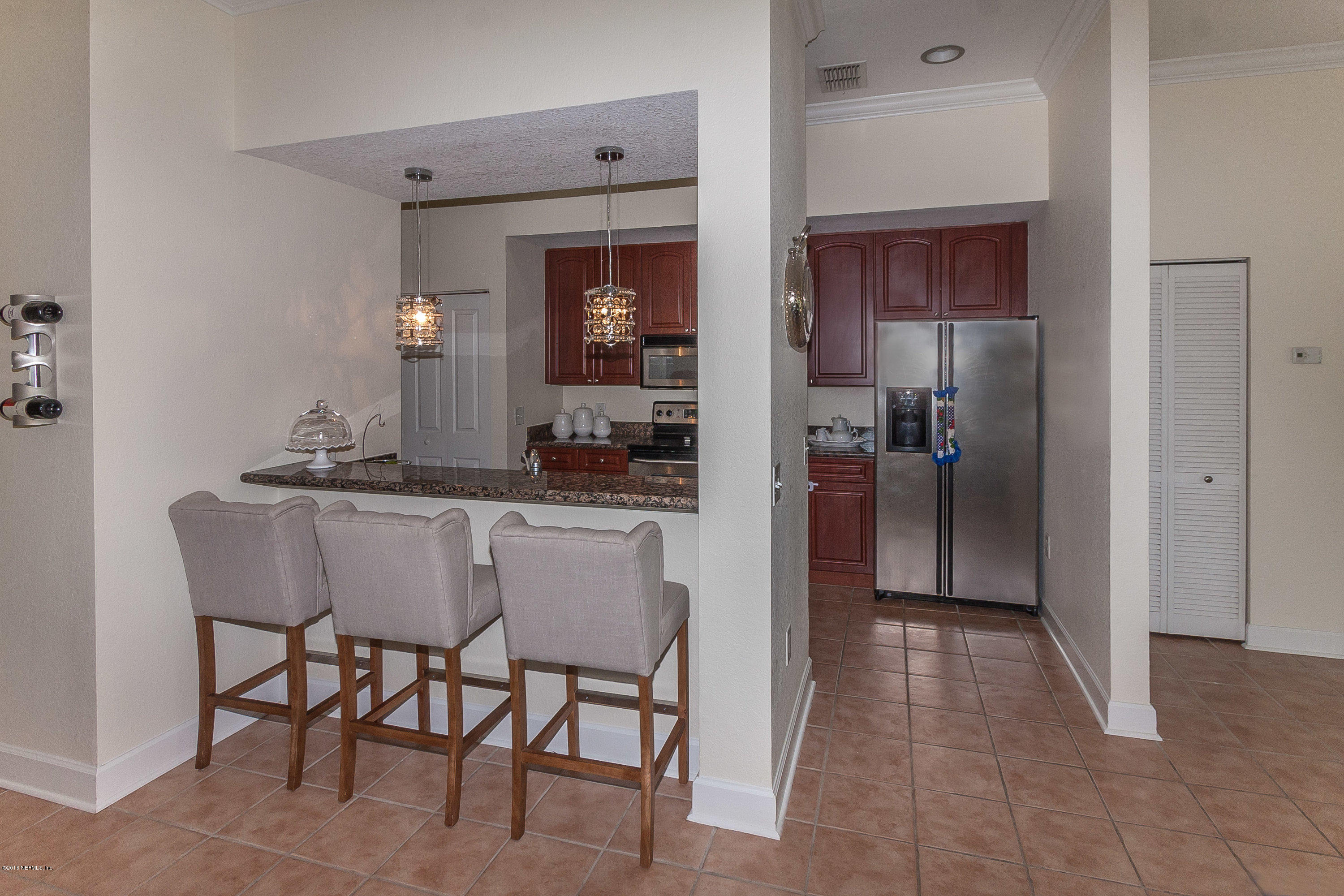 9745 Touchton Road, Unit 2521 Jacksonville, FL 32246 - Photo 7 of 31 a dining room with a table and chairs