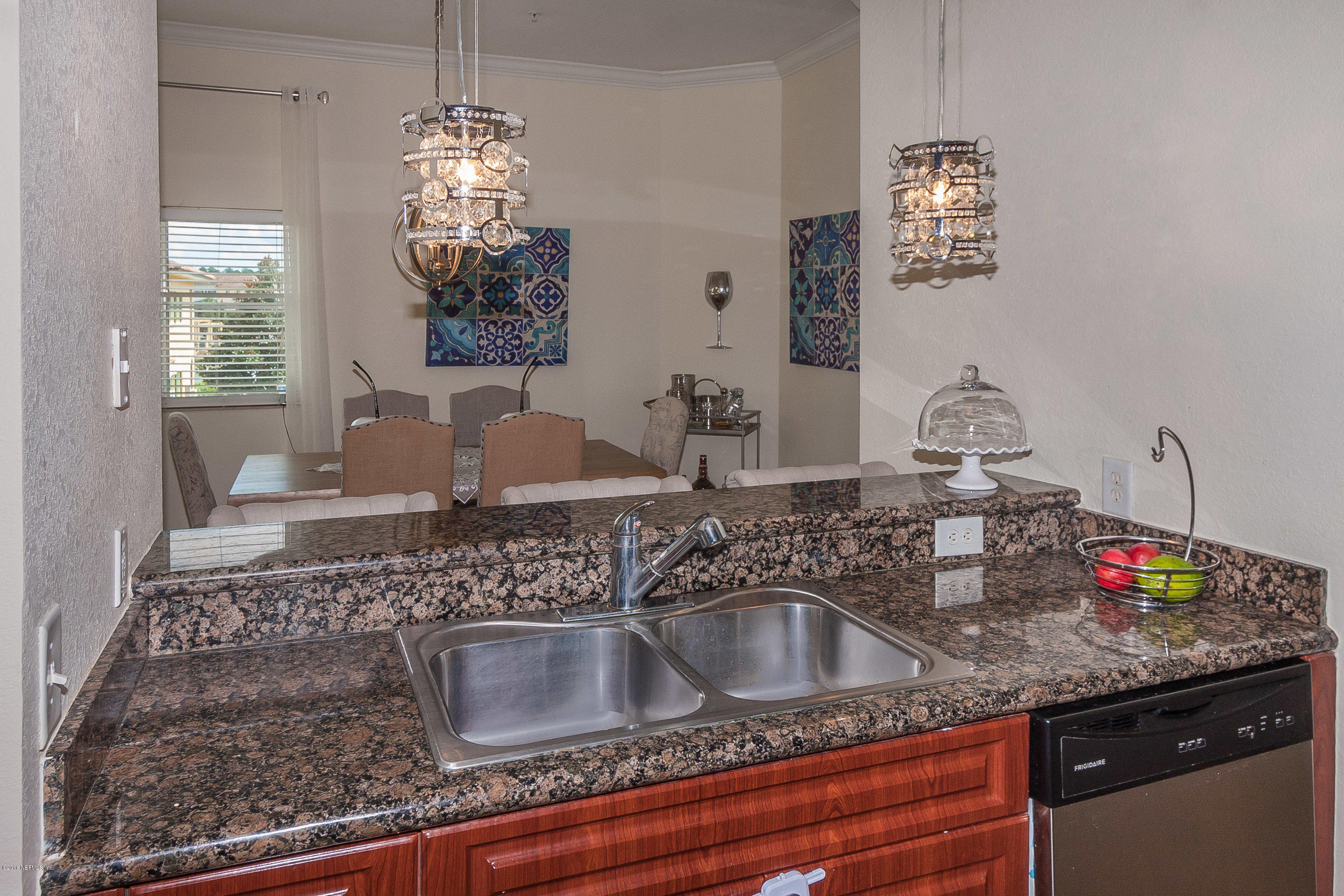 9745 Touchton Road, Unit 2521 Jacksonville, FL 32246 - Photo 8 of 31 a kitchen with sink and granite