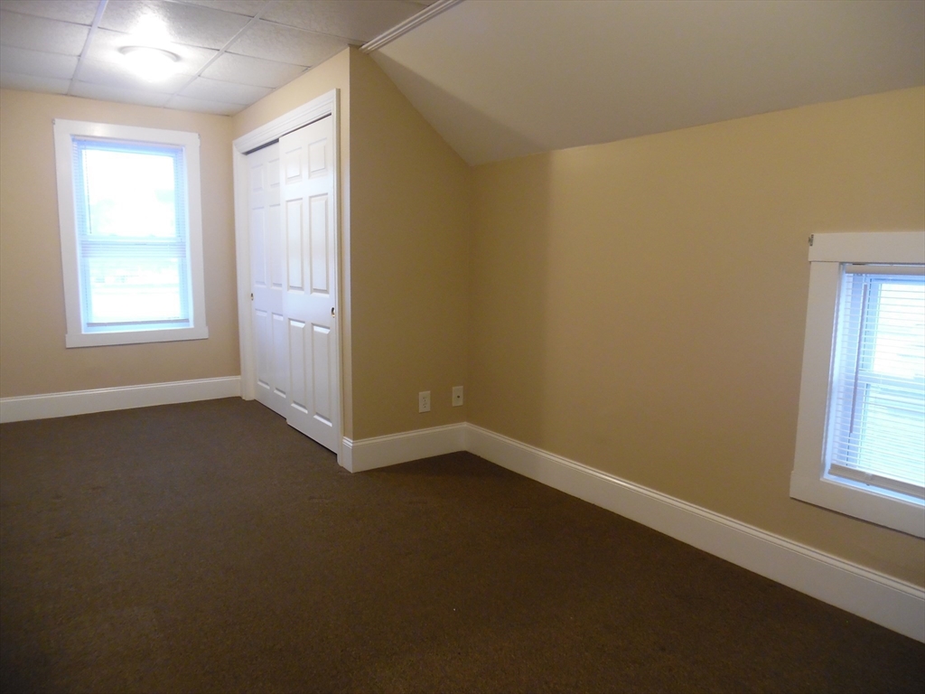 1199 Rodman Street, Unit 3 Fall River, MA 02721 - Photo 4 of 8 an empty room with a window