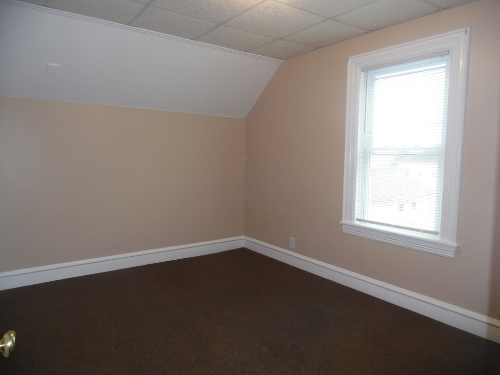 1199 Rodman Street, Unit 3 Fall River, MA 02721 - Photo 5 of 8 an empty room with a window