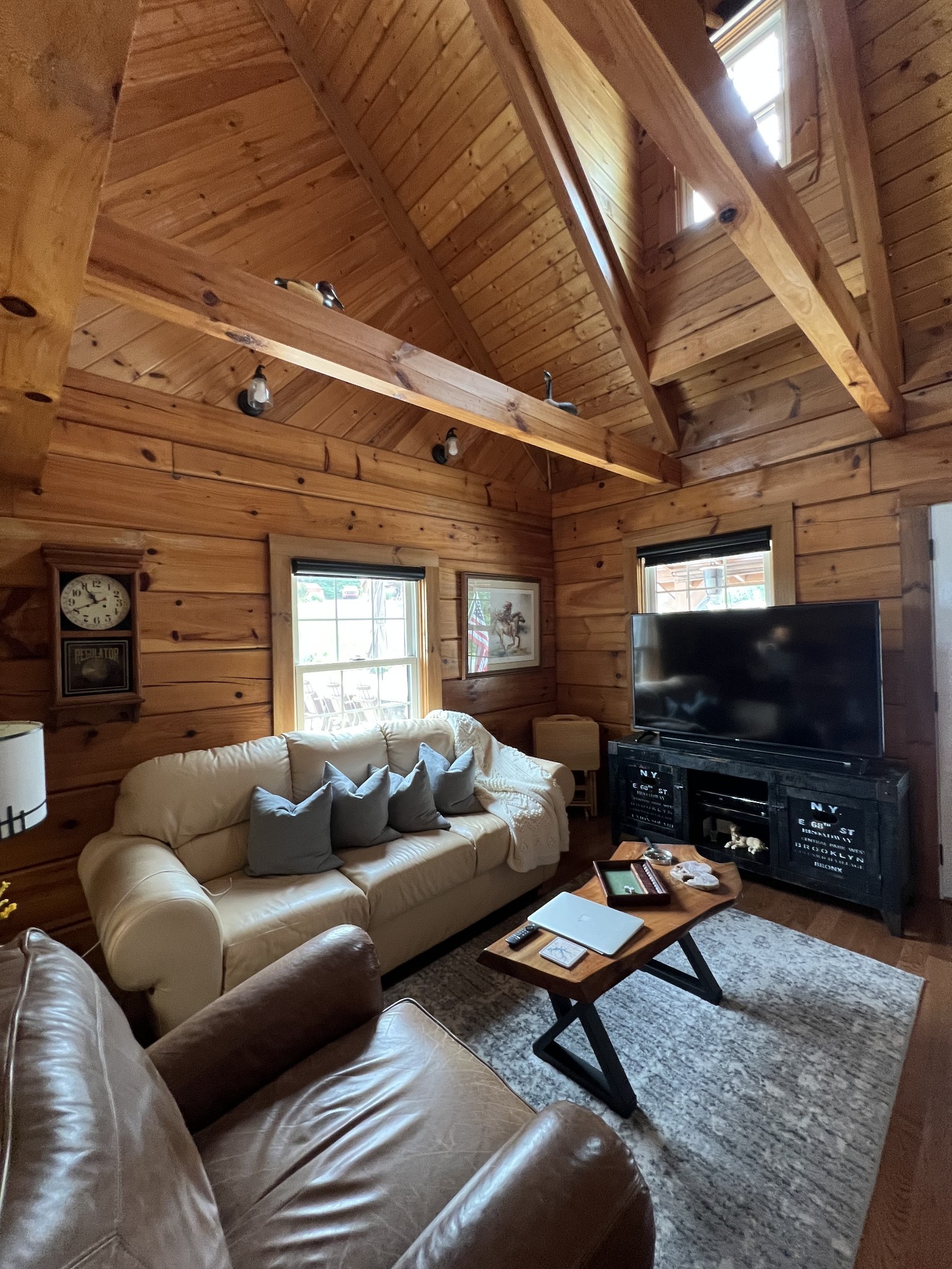 225 Bill Hunter Road Celina, TN 38551 - Photo 18 of 57 a living room with furniture a flat screen tv and a fireplace