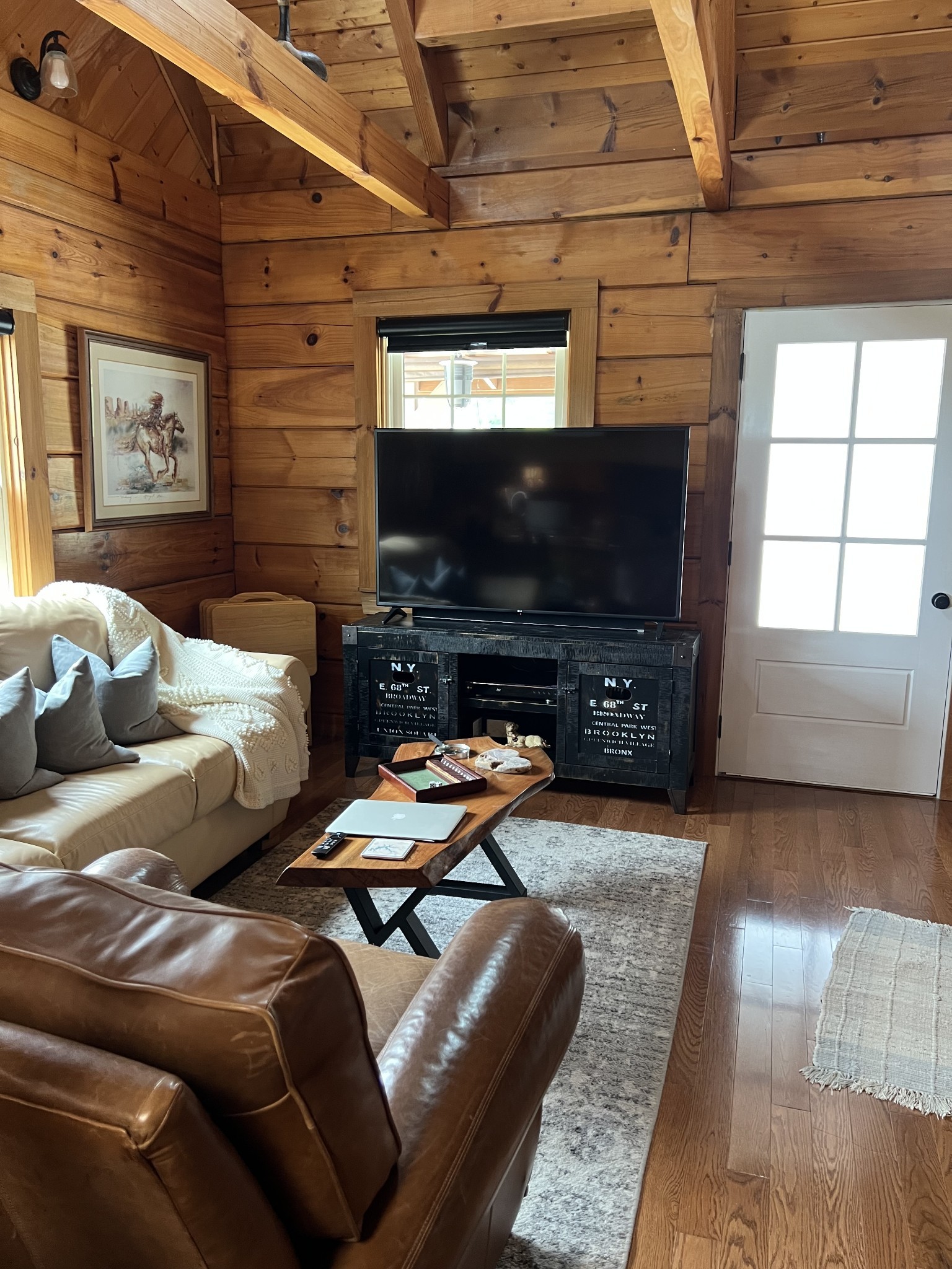 225 Bill Hunter Road Celina, TN 38551 - Photo 24 of 57 a living room with furniture and a flat screen tv